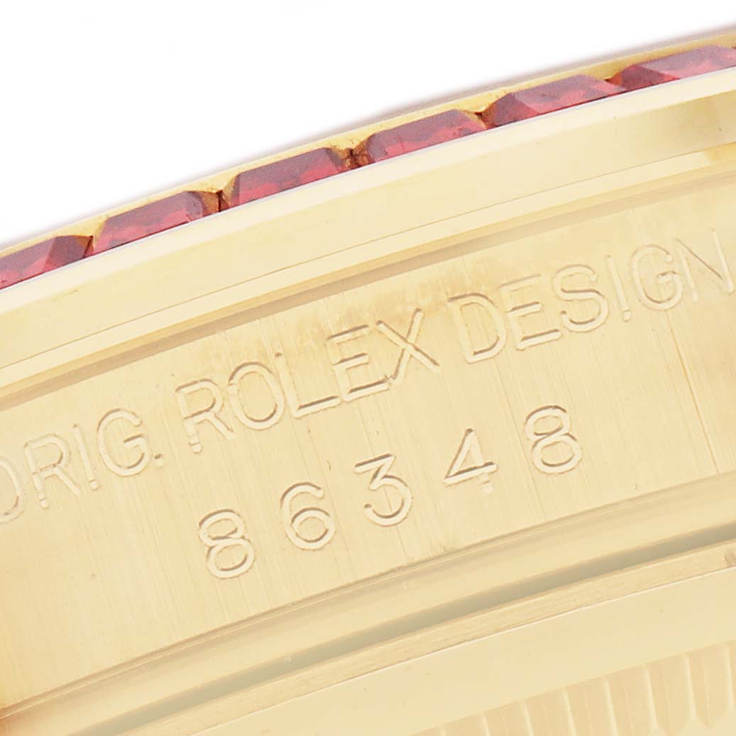 The image shows a close-up of the engraved side of a Rolex Pearlmaster 86348 Men
s Yellow Gold Champagne Dial 86348 Men
s Yellow Gold Champagne Dial watch case, highlighting the model number and design details.