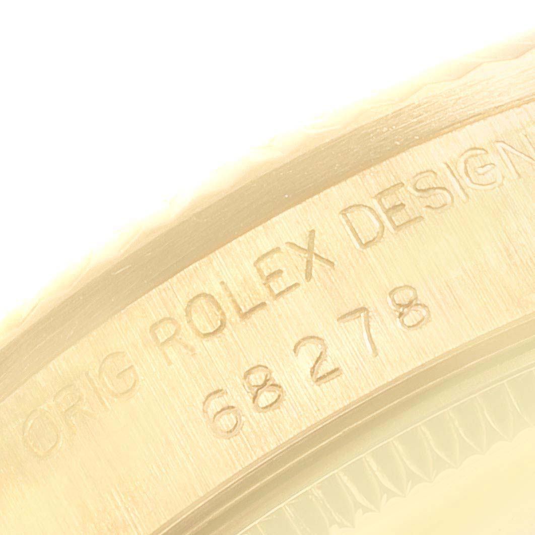 The image shows the engraved side of the case of a Rolex President 68278 Women's Yellow Gold Blue Dial watch, highlighting the model number and design details.