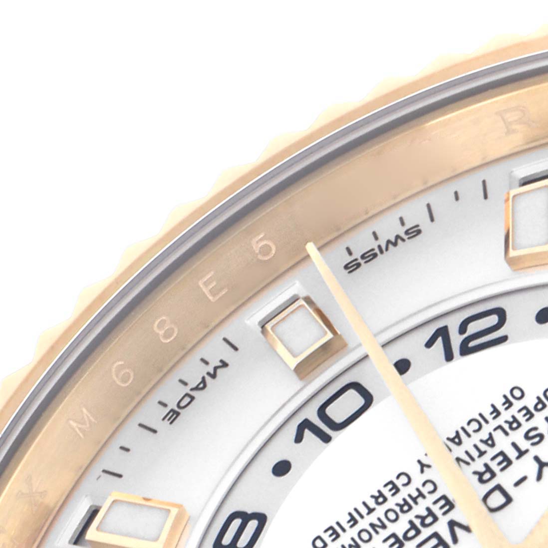 The image shows a close-up of the Rolex Sky-Dweller 326938 Men
s Yellow Gold White Dial 326938 Men
s Yellow Gold White Dial
s dial and bezel, focusing on hour markers and part of the watch face.