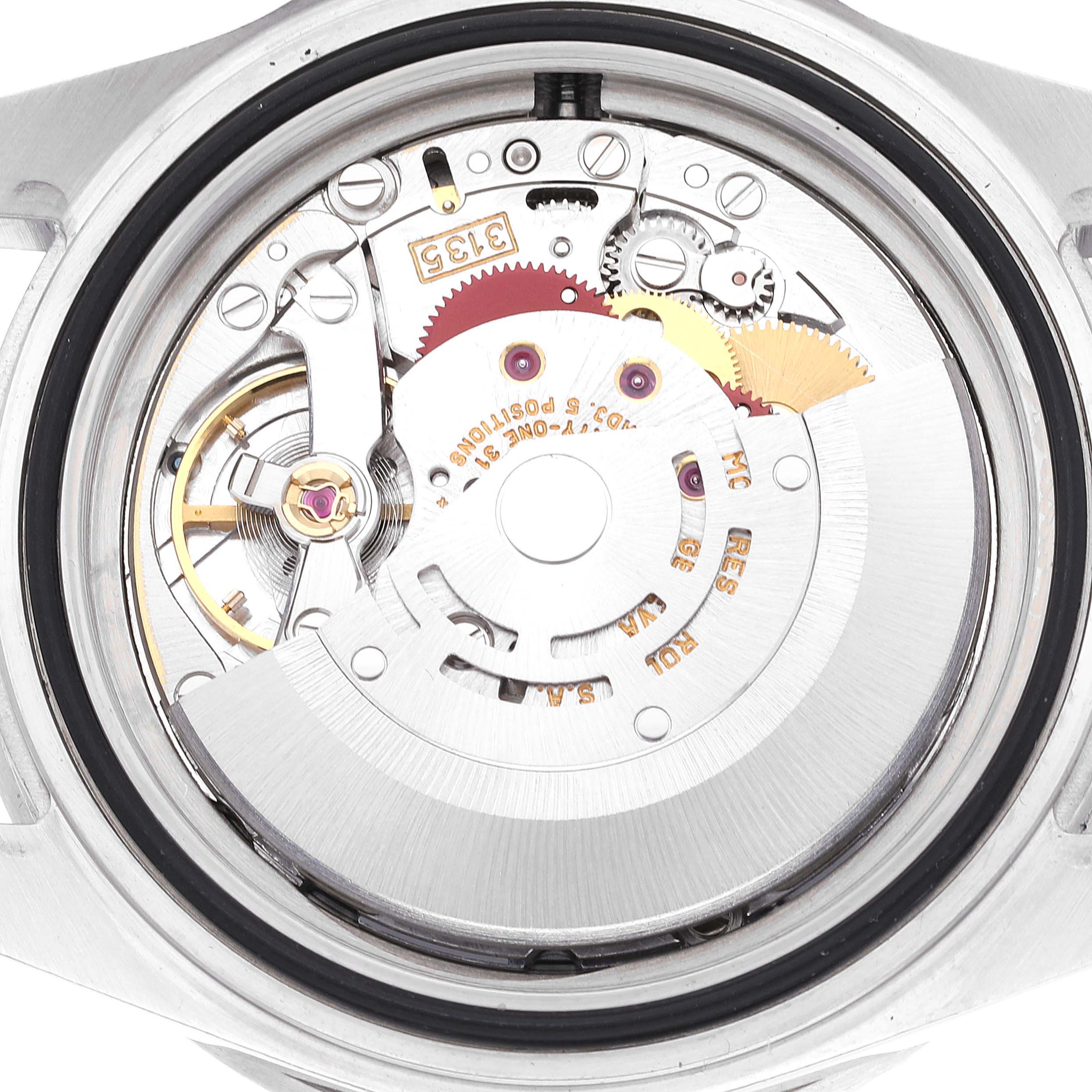 The image shows a close-up view of the movement and inner mechanisms of a Rolex Submariner 16610 Men
s Stainless Steel Black Dial 16610 Men
s Stainless Steel Black Dial watch from the case back.