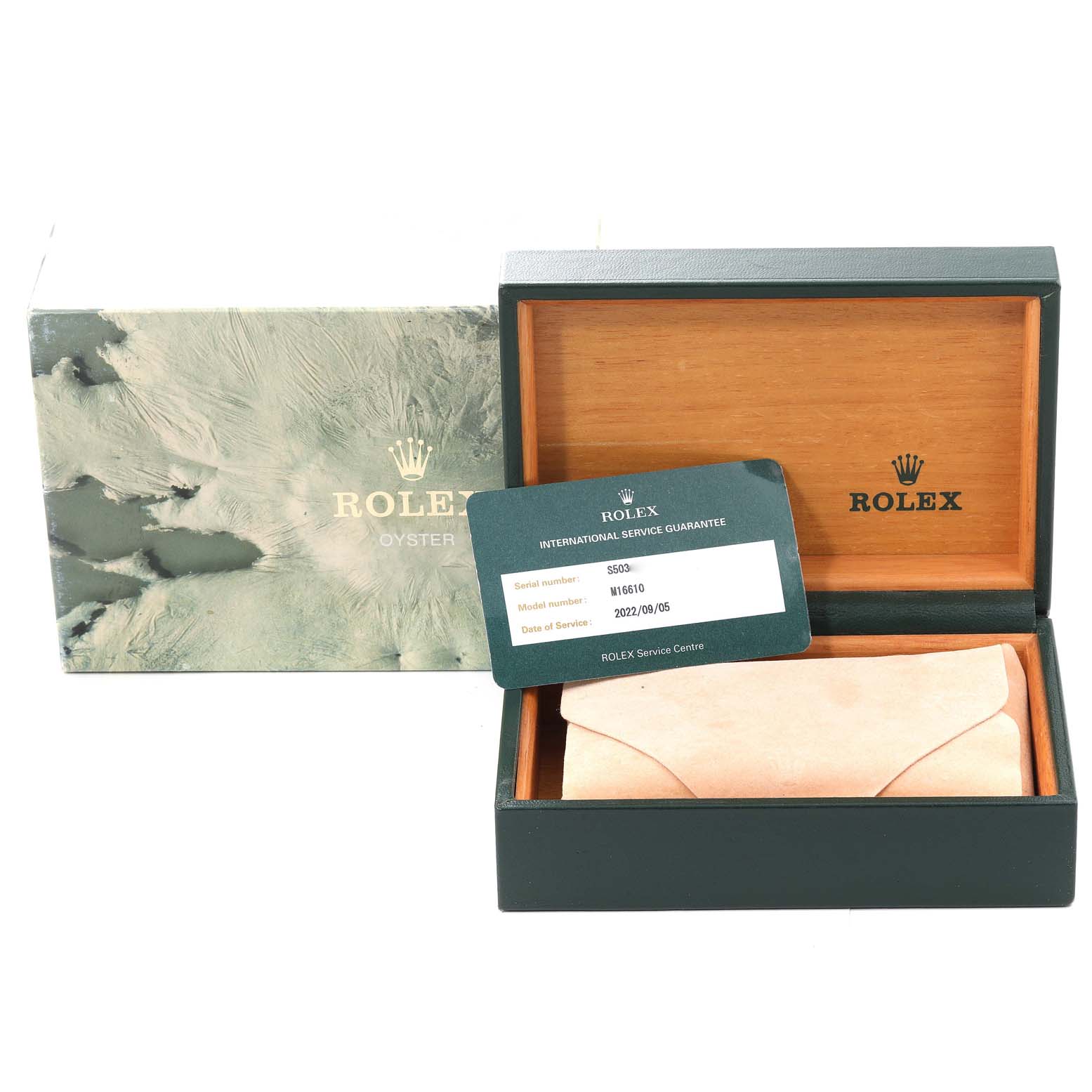 The image shows a Rolex Submariner 16610 Men
s Stainless Steel Black Dial 16610 Men
s Stainless Steel Black Dial watch box, warranty card, and outer packaging.