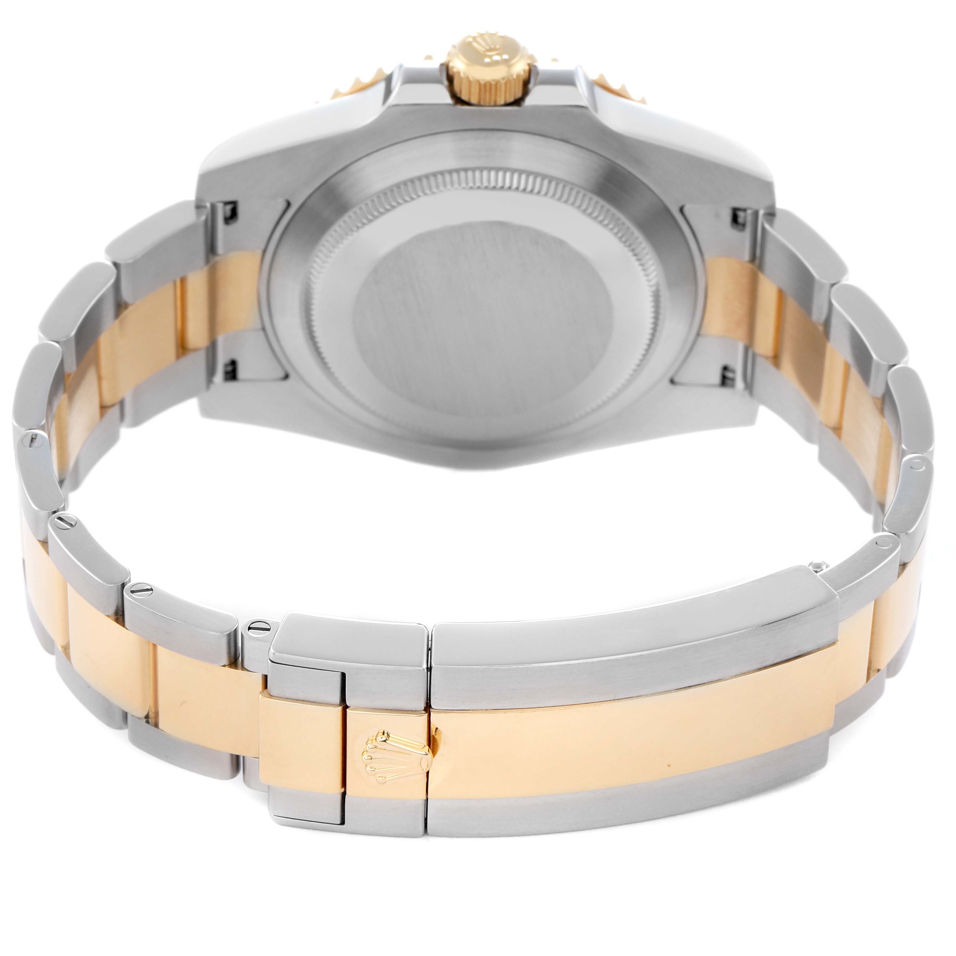 The image shows the back view of a Rolex Submariner 116613 Men's Steel and Gold (two tone) Black Dial 116613 Men's Steel and Gold (two tone) Black Dial, highlighting the case back and clasp on the bracelet.