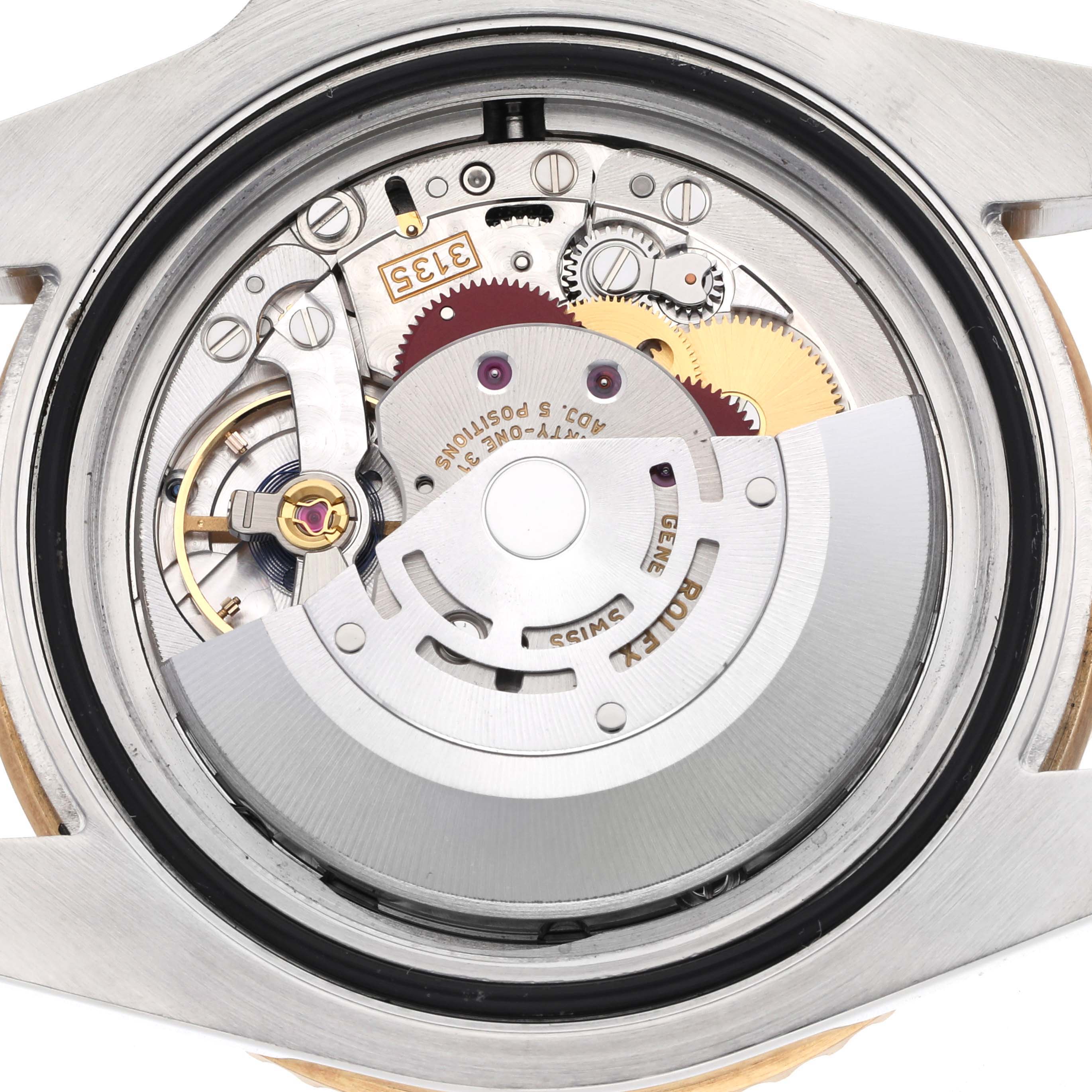 The image shows the Rolex Submariner 116613 Men's Steel and Gold (two tone) Blue Dial 116613 Men's Steel and Gold (two tone) Blue Dial watch movement from the back, revealing gears and the rotor.