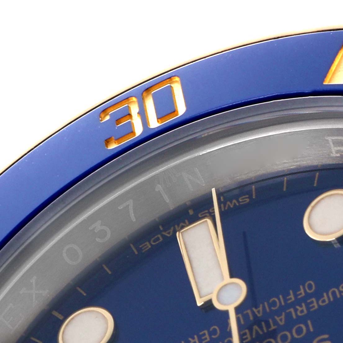 The image shows a close-up of the blue bezel and dial of a Rolex Submariner 116613 Men's Steel and Gold (two tone) Blue Dial 116613 Men's Steel and Gold (two tone) Blue Dial, focusing on the numerals "30" and part of the watch face.