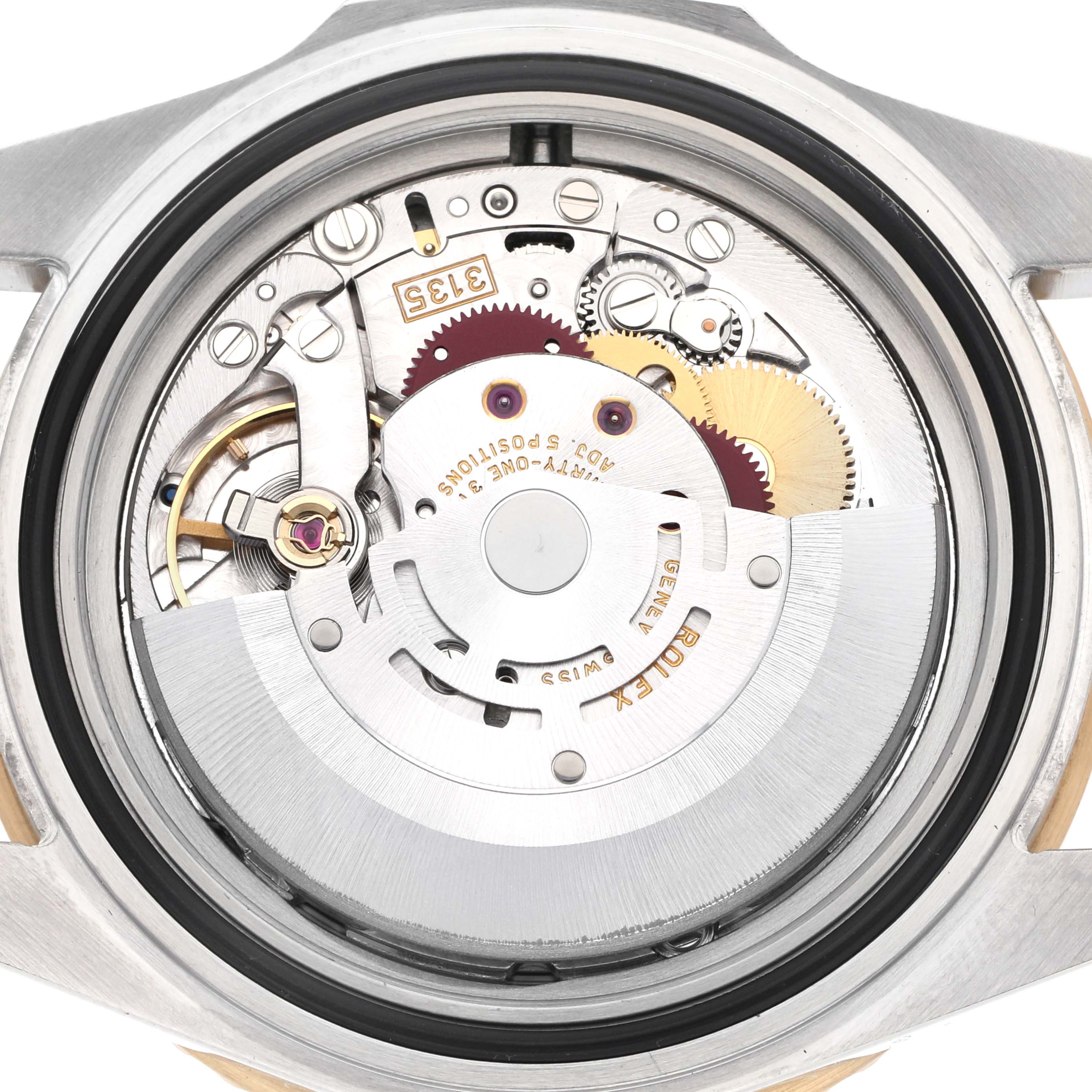 The image shows the back view of a Rolex Submariner 16613 Men
s Steel and Gold (two tone) Blue Dial 16613 Men
s Steel and Gold (two tone) Blue Dial, highlighting the intricate movement and gears.