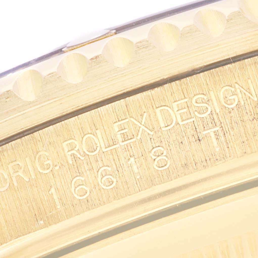 The image shows a close-up of the bezel and case side of a Rolex Submariner 16618 Men's Yellow Gold Black Dial 16618 Men's Yellow Gold Black Dial, highlighting the engraved text and model number.