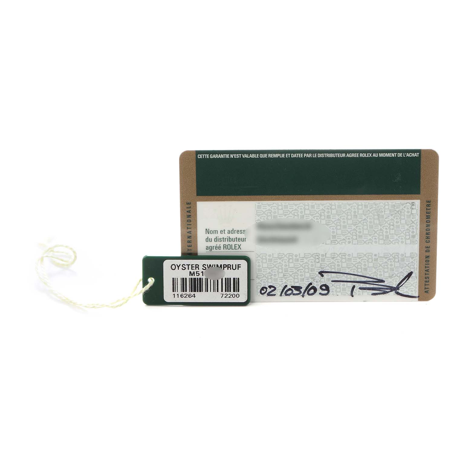 The image shows a warranty card and tag for the Rolex Turn-o-Graph 116264 Men
s Stainless Steel Black Dial 116264 Men
s Stainless Steel Black Dial.