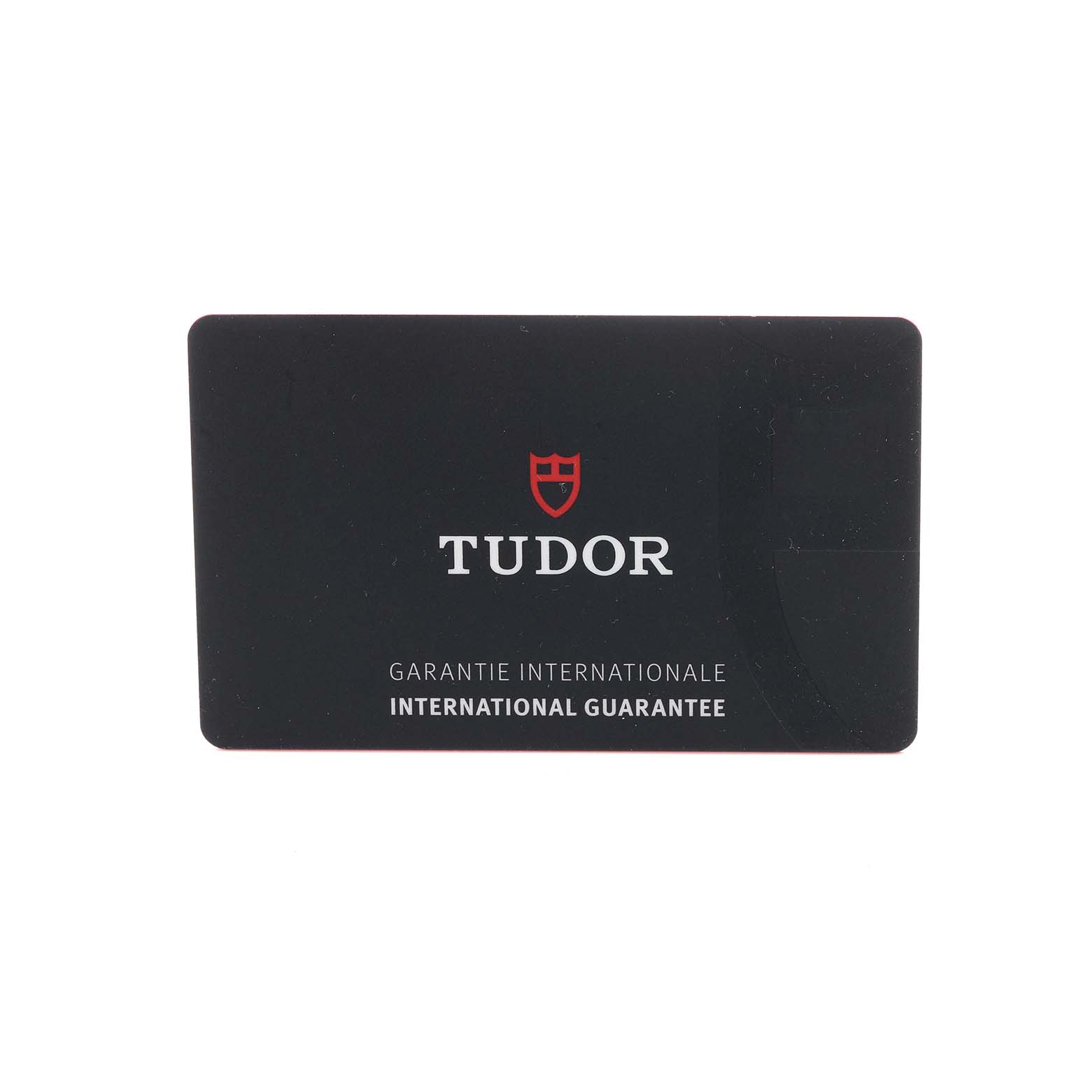 The image shows an international guarantee card for the Tudor Heritage Black Bay 79010 Men
s Stainless Steel Grey Dial 79010 Men
s Stainless Steel Grey Dial watch.