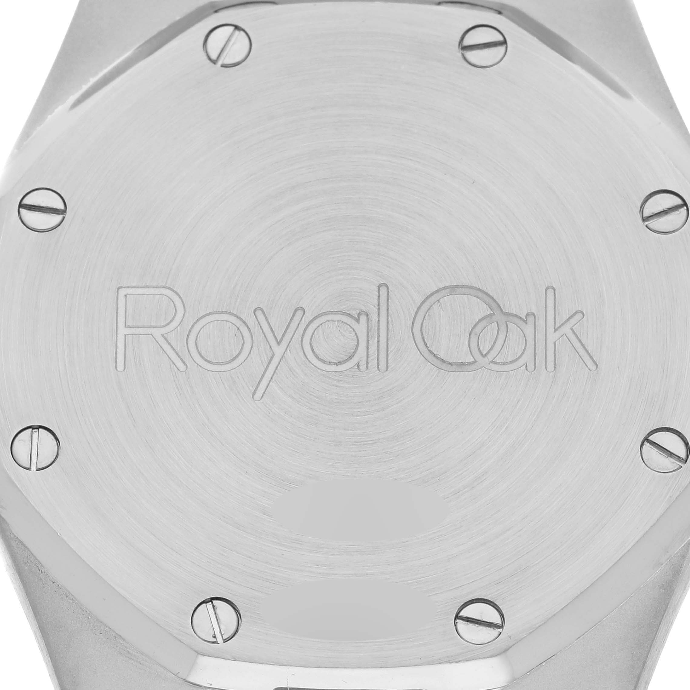 The image shows the back of an Audemars Piguet Royal Oak 25730ST Men's Stainless Steel Black Dial 25730ST Men's Stainless Steel Black Dial watch, highlighting its screws and engraved logo.