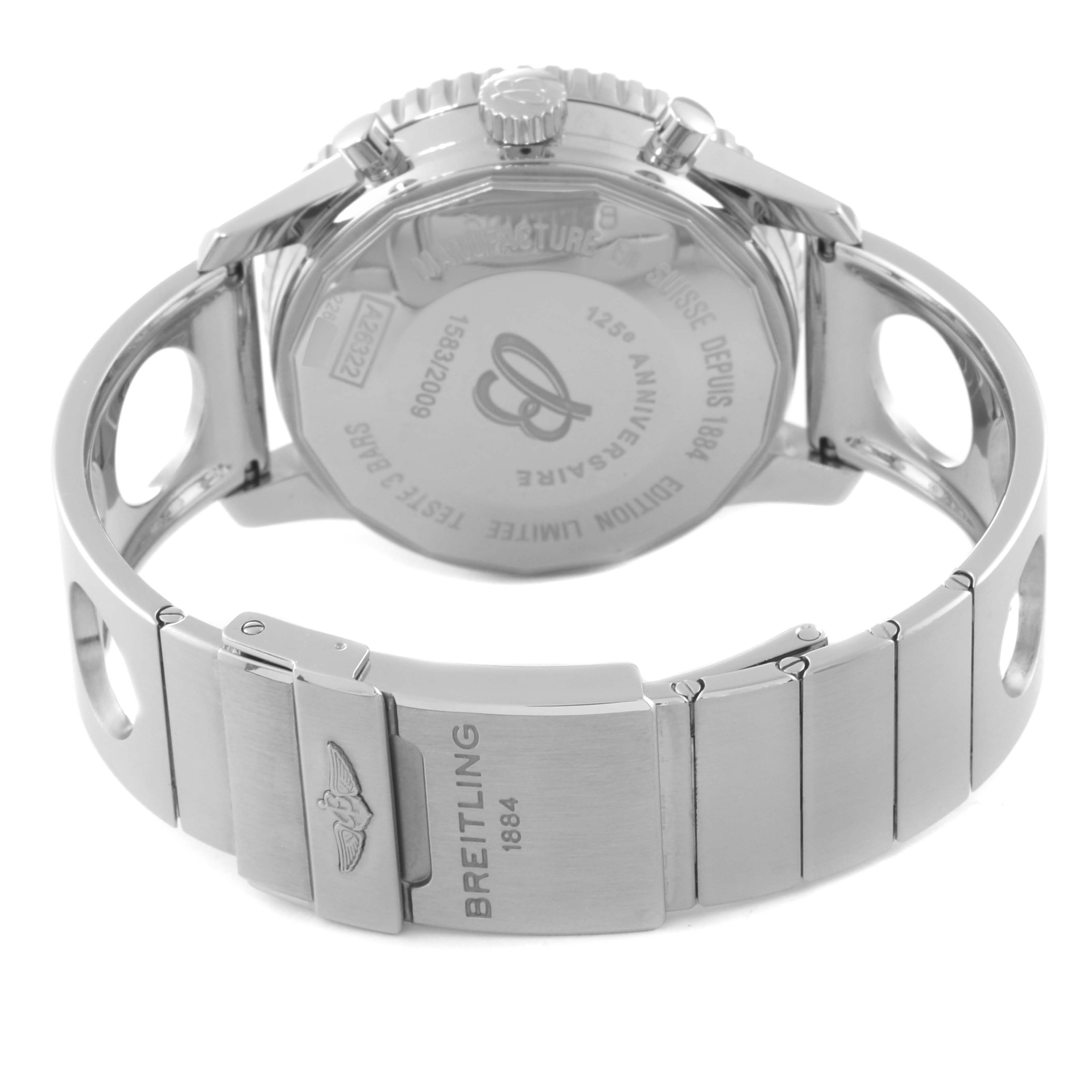 The image shows the rear view of a Breitling Limited Series watch, highlighting the engraved case back and metal bracelet with a clasp.