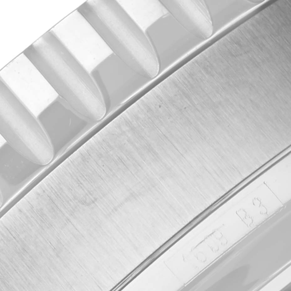 The image shows a close-up of the bezel teeth and case side of the Breitling Limited Series model.