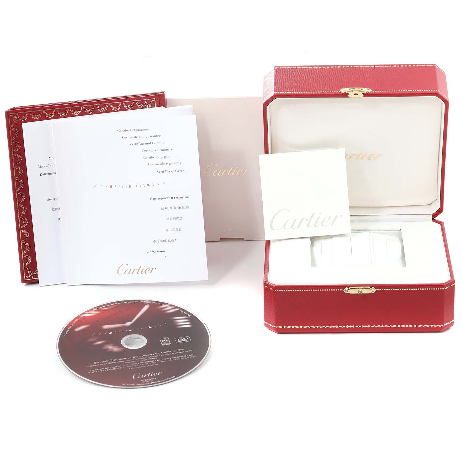 The image shows the packaging and accessories for the Calibre de Cartier by Cartier, including a box, manuals, and a DVD.