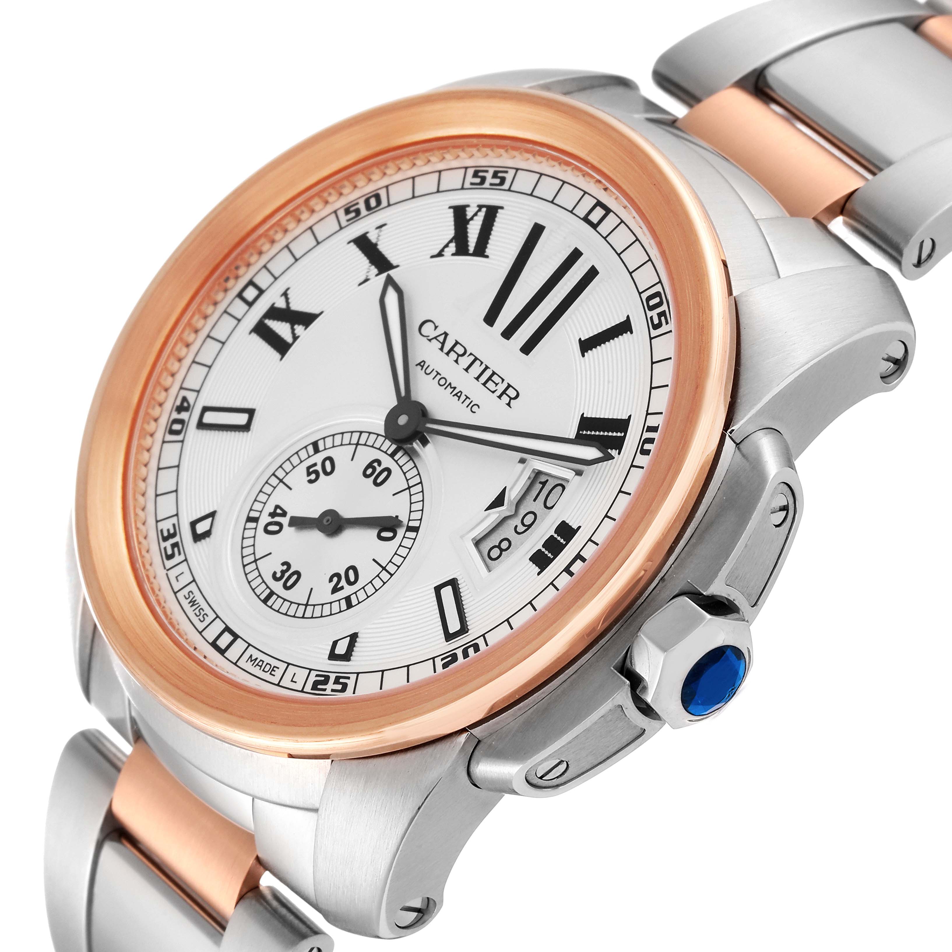 The image shows a close-up of the face and part of the bracelet of a Calibre de Cartier model by Cartier, from an angled perspective.