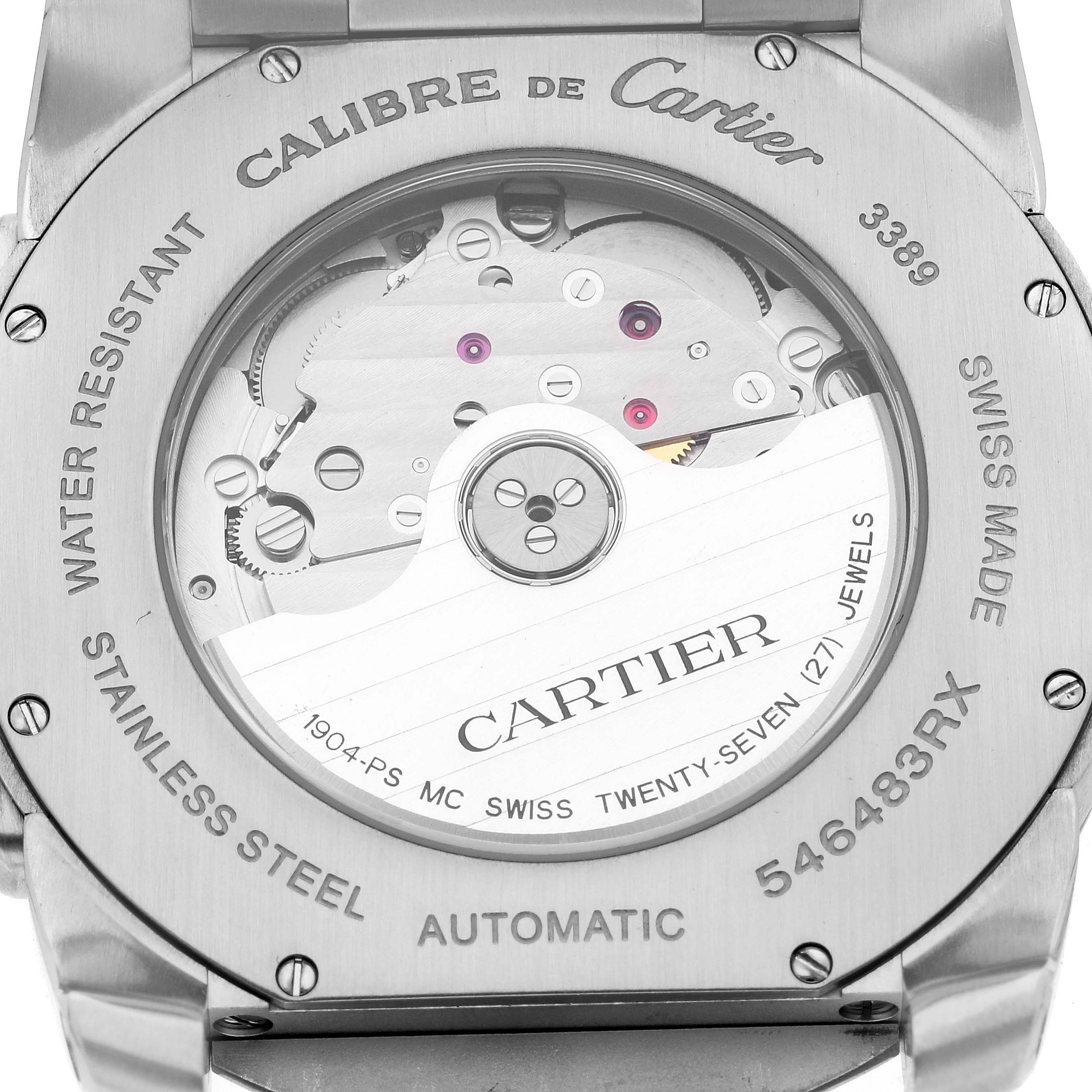 The image shows the back view of the Calibre de Cartier model by Cartier, highlighting the automatic movement and internal mechanics.