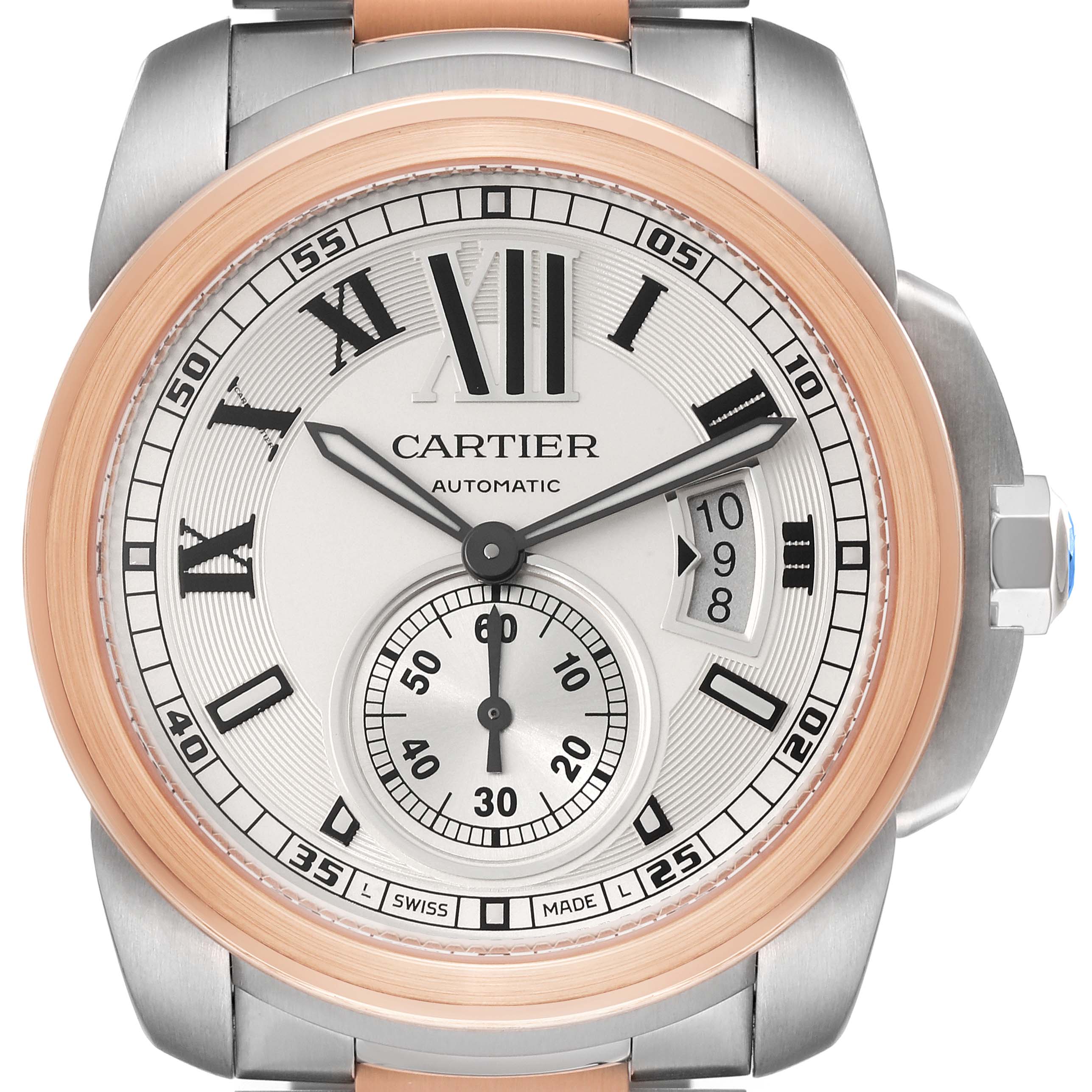 The image shows the front view of the Calibre de Cartier automatic watch by Cartier, highlighting its dial and bezel.