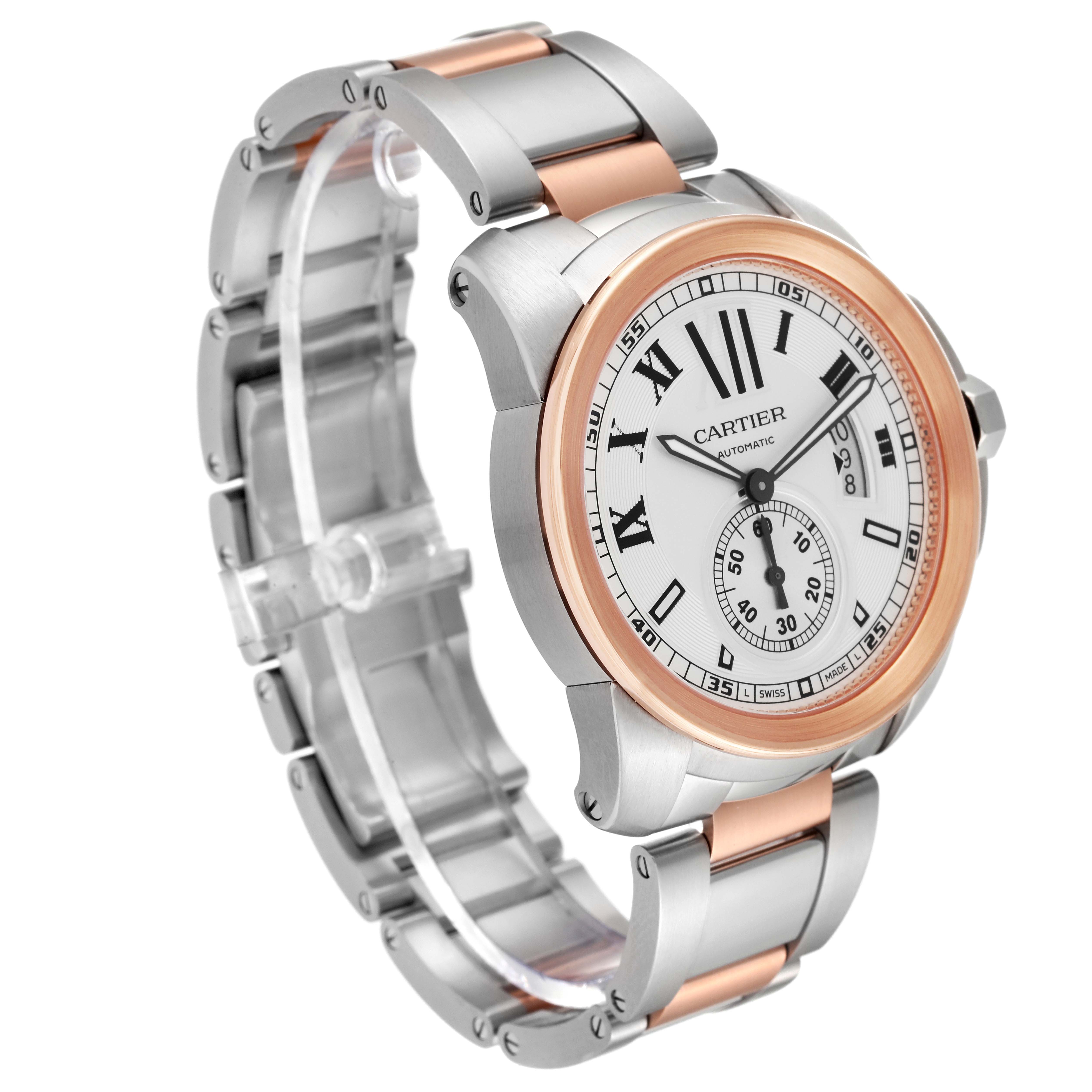 The Calibre de Cartier watch by Cartier is shown at a three-quarter angle, displaying its face, bezel, and two-tone bracelet.