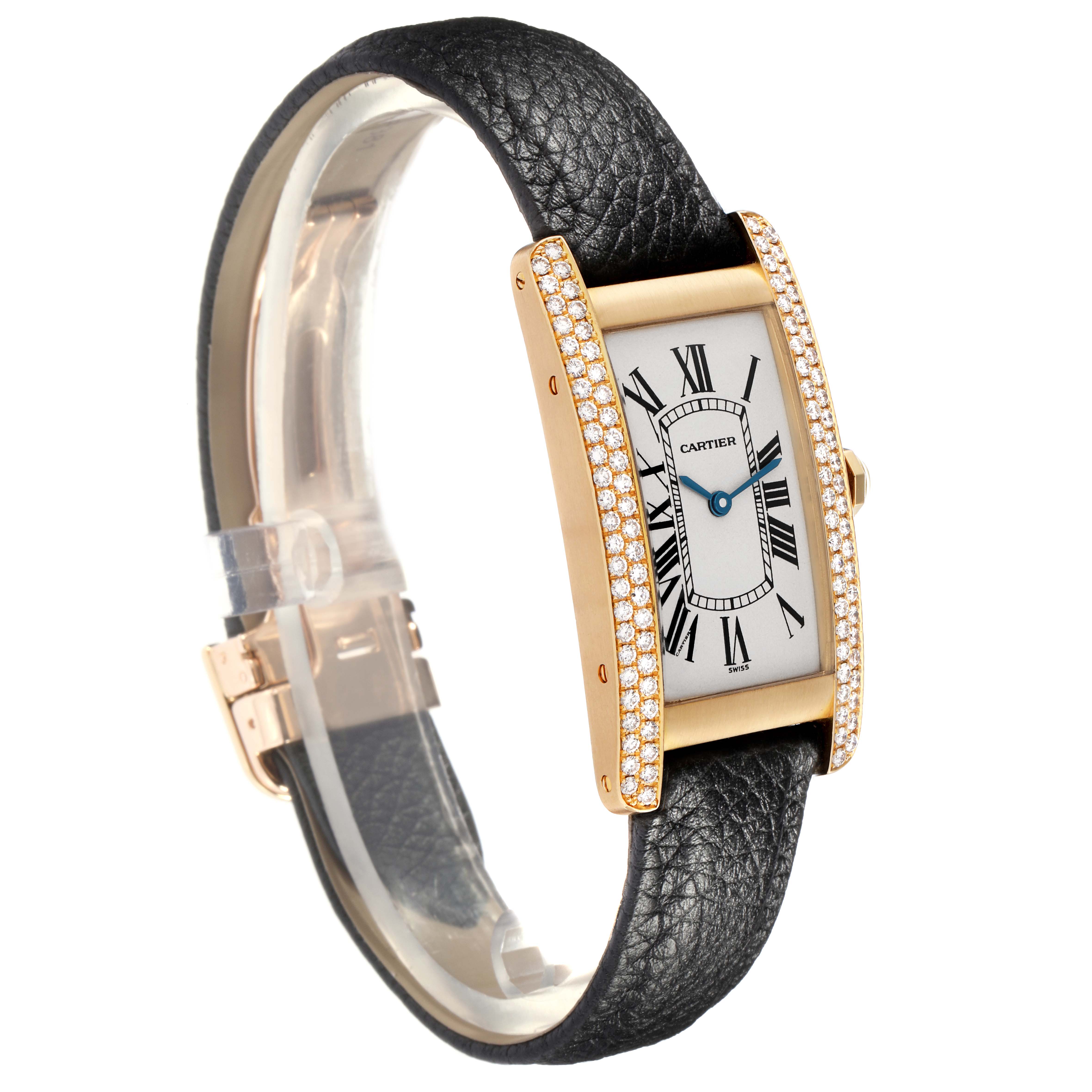 The Cartier Tank Américaine is shown at a slight angle, highlighting its rectangular face, diamond-set bezel, and black leather strap.