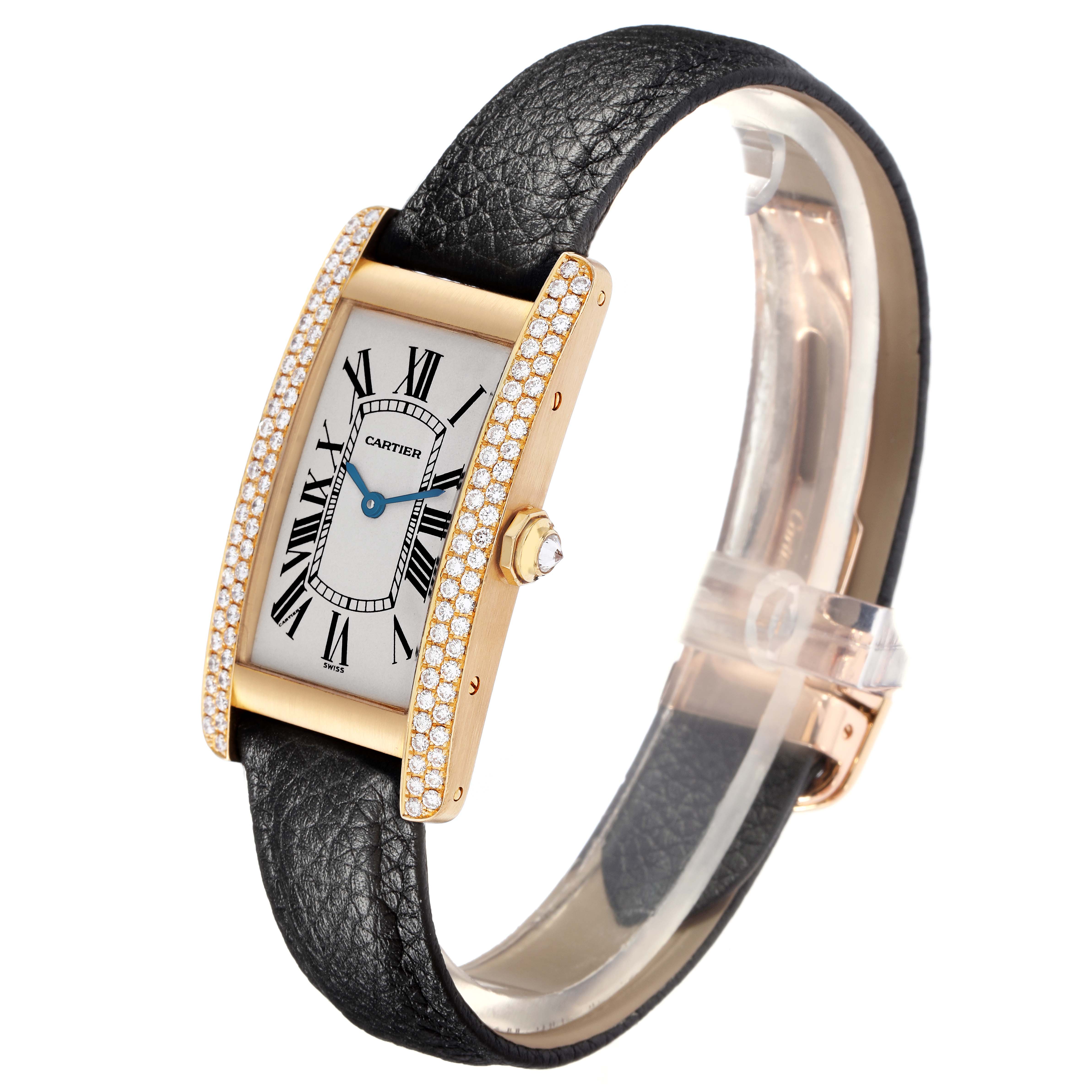 The Cartier Tank Americaine 17201 Men
s Yellow Gold Silver Dial 17201 Men
s Yellow Gold Silver Dial watch is shown at a slight angle, highlighting its face, diamond-set case, and black leather strap.