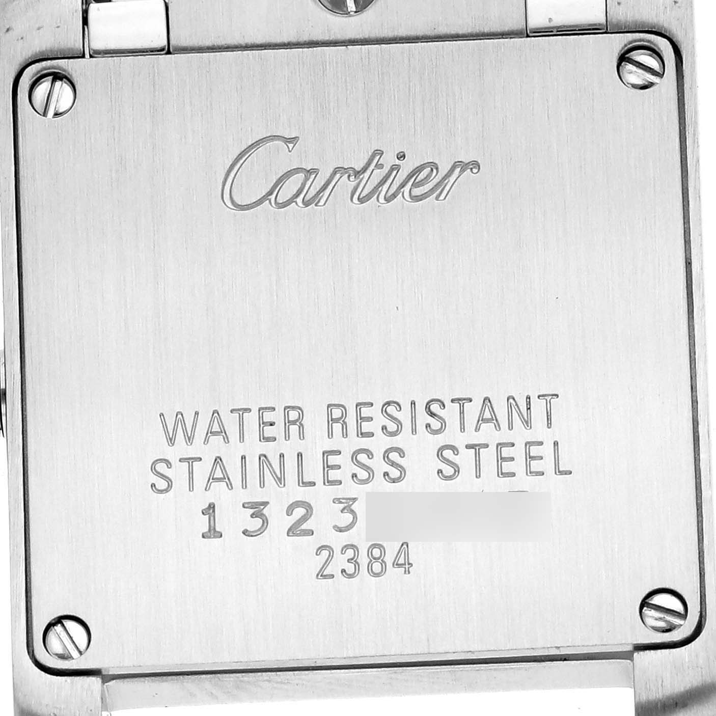 The image shows the back of a Cartier Tank Française watch, highlighting its stainless steel casing and water resistance details.