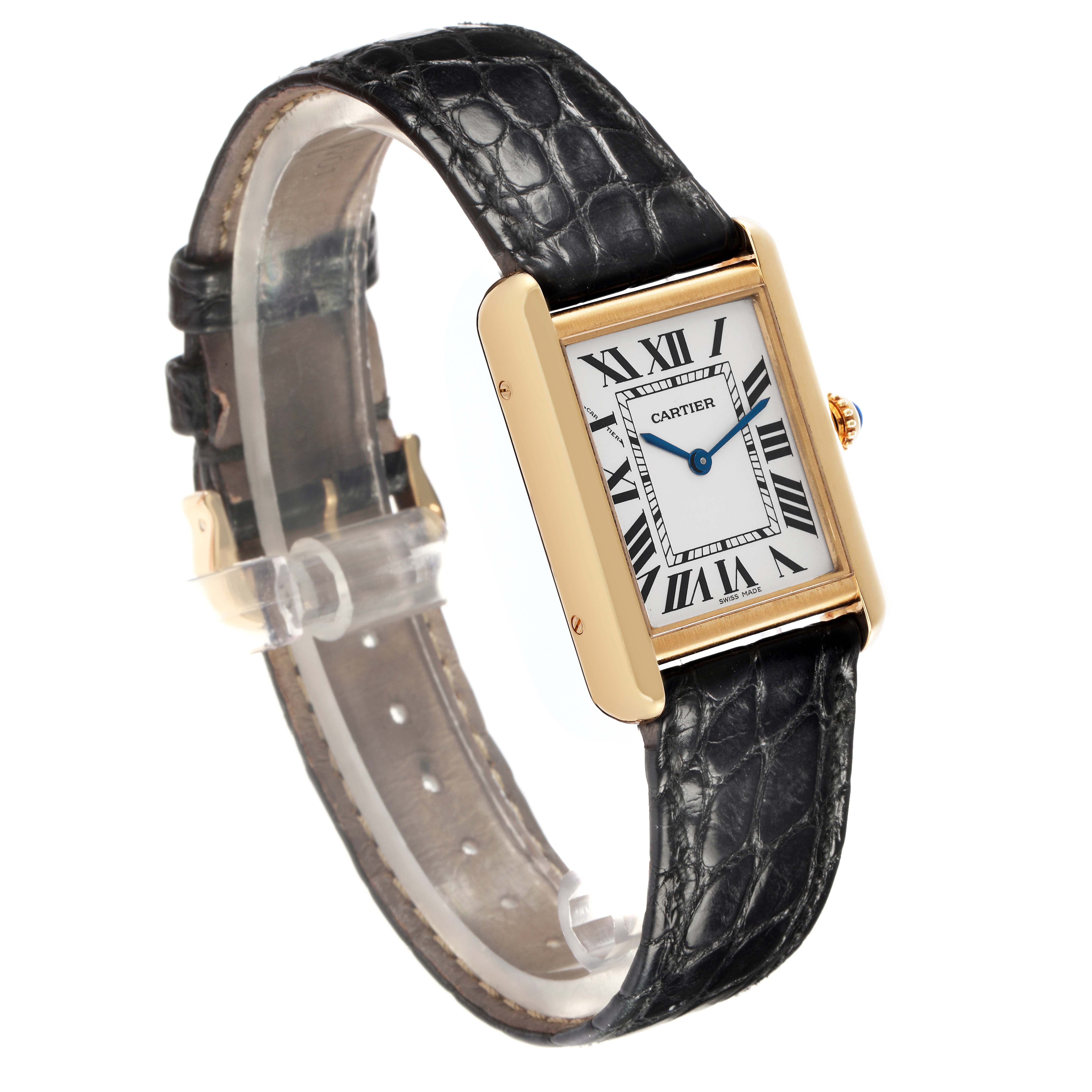 The Cartier Tank Solo W1018755 Women
s Steel and Gold (two tone) Silver Dial W1018755 Women
s Steel and Gold (two tone) Silver Dial watch is shown at an angled side view, displaying its face, band, and gold-tone casing.