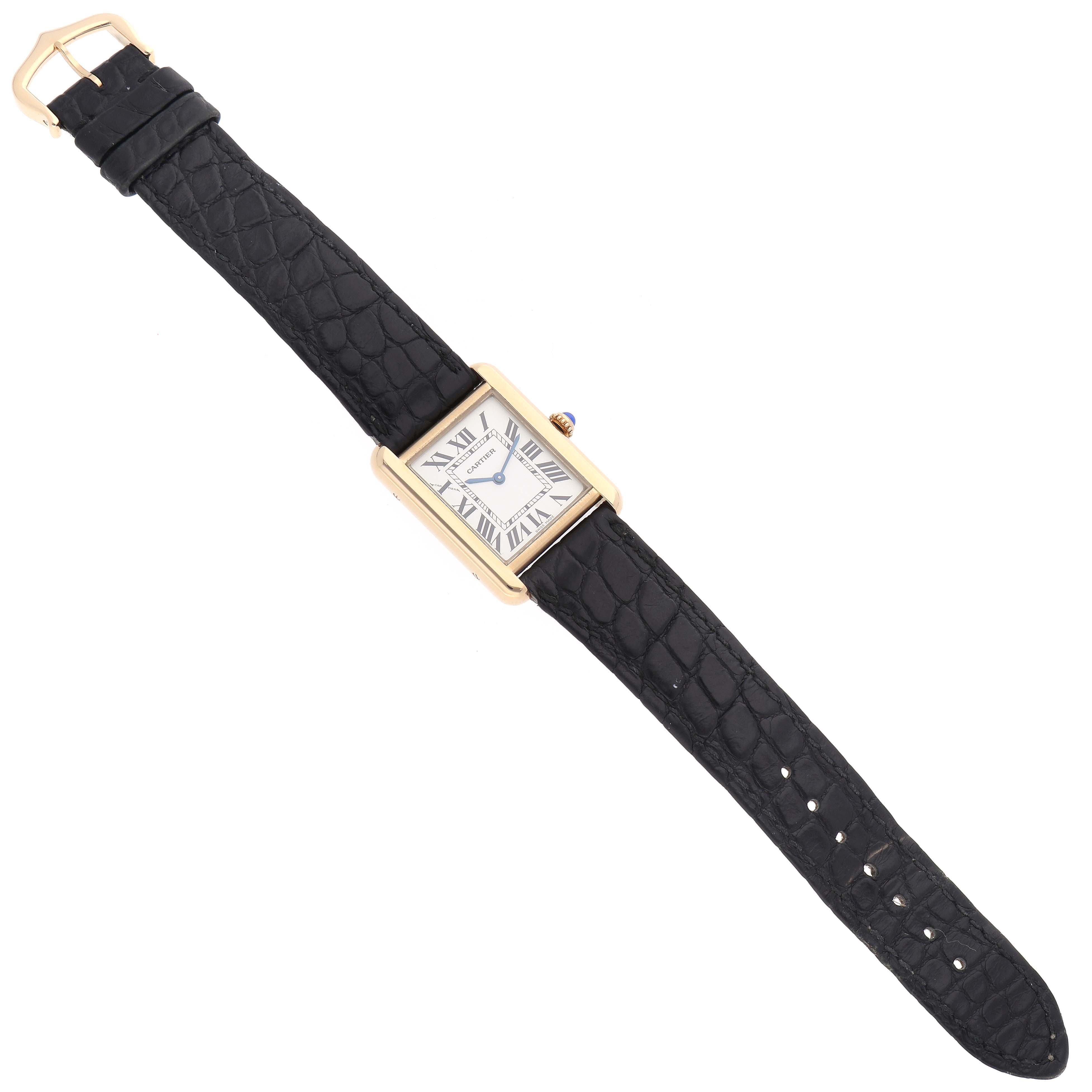 The Cartier Tank Solo W1018755 Women
s Steel and Gold (two tone) Silver Dial W1018755 Women
s Steel and Gold (two tone) Silver Dial watch is shown from a top-down angle, highlighting the face, rectangular case, and black leather strap.