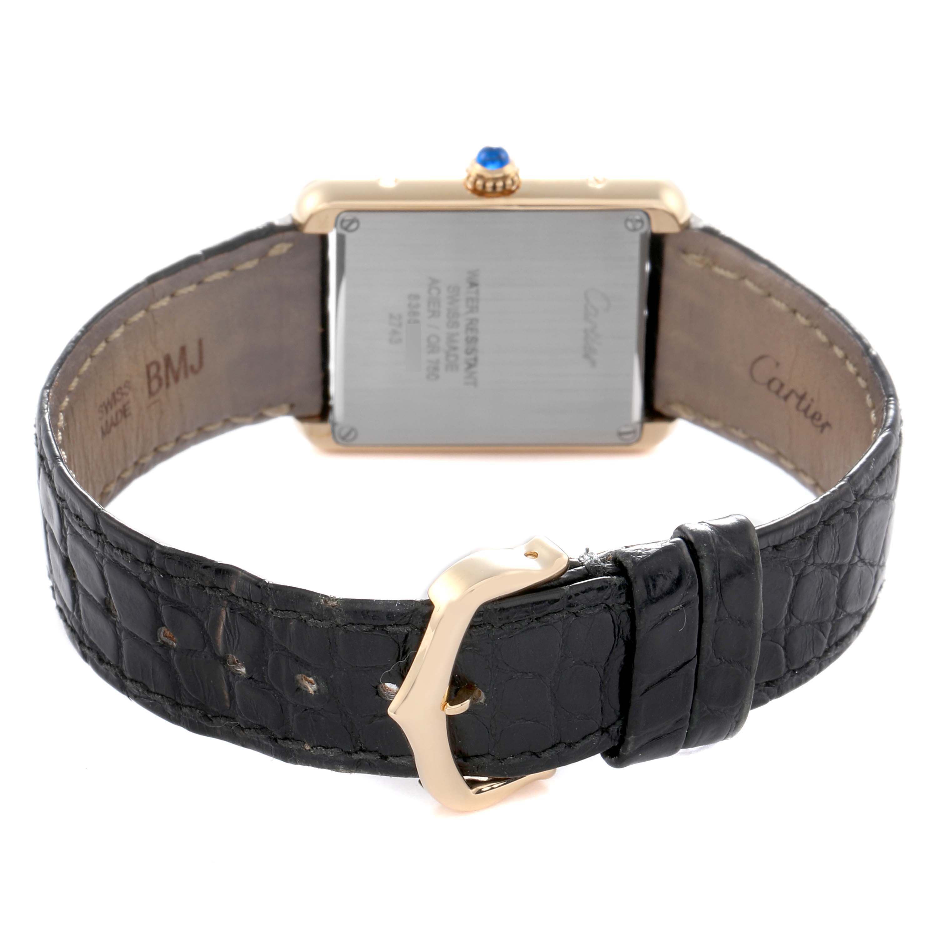 The Cartier Tank Solo W1018755 Women
s Steel and Gold (two tone) Silver Dial W1018755 Women
s Steel and Gold (two tone) Silver Dial watch is shown from the rear, displaying the back case, strap, and buckle.