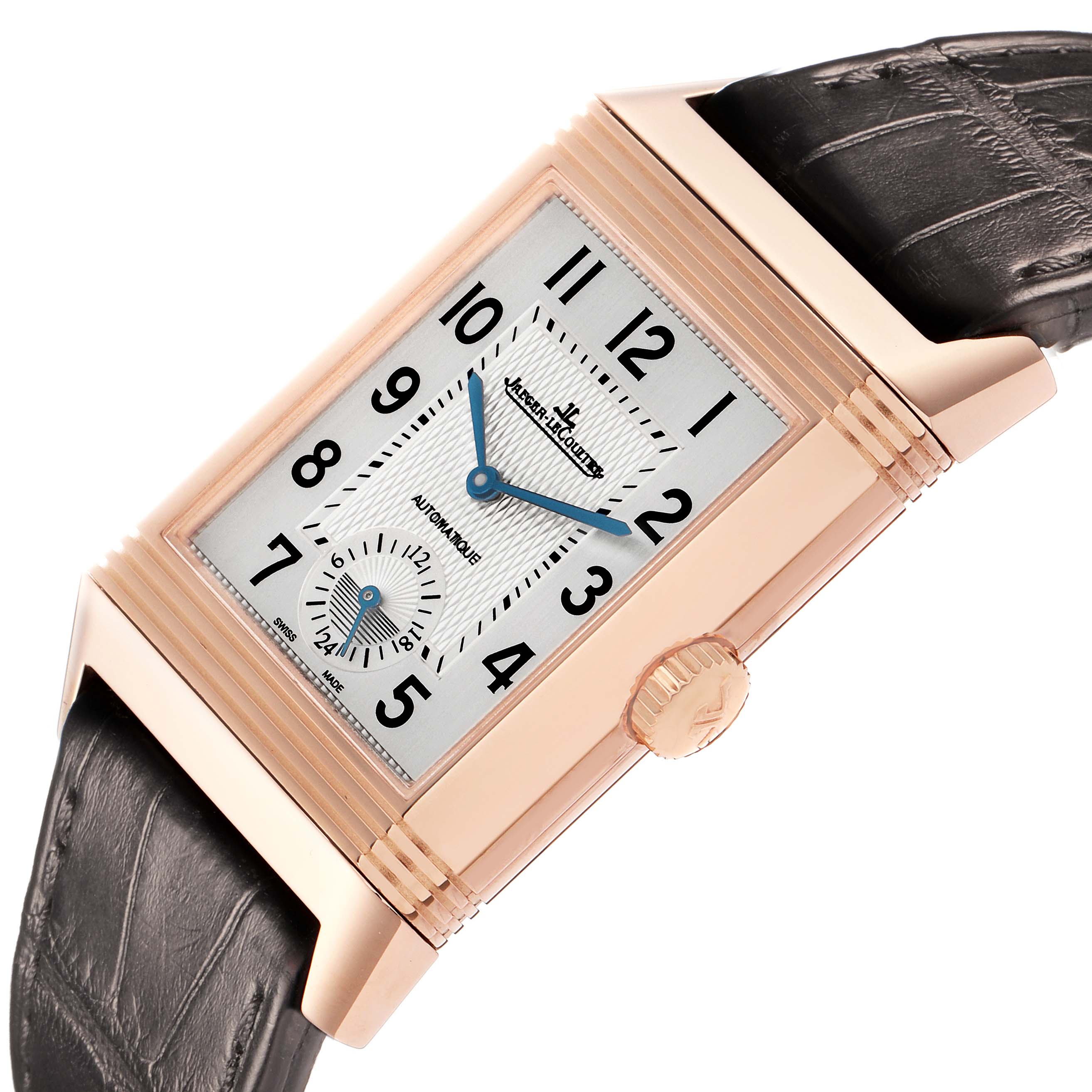 The Jaeger-LeCoultre Reverso watch is shown at an angle highlighting its rectangular face, crown, and leather strap.