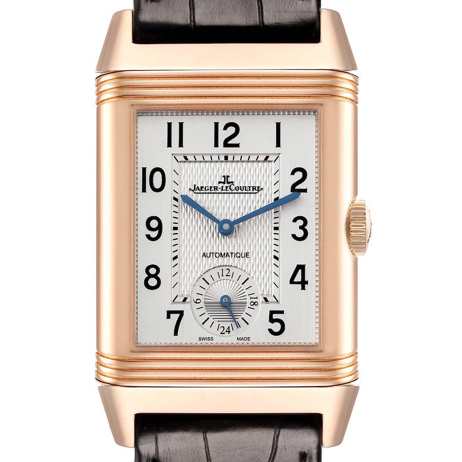 The Jaeger LeCoultre Reverso watch is shown front-on, highlighting the dial, crown, and leather strap.