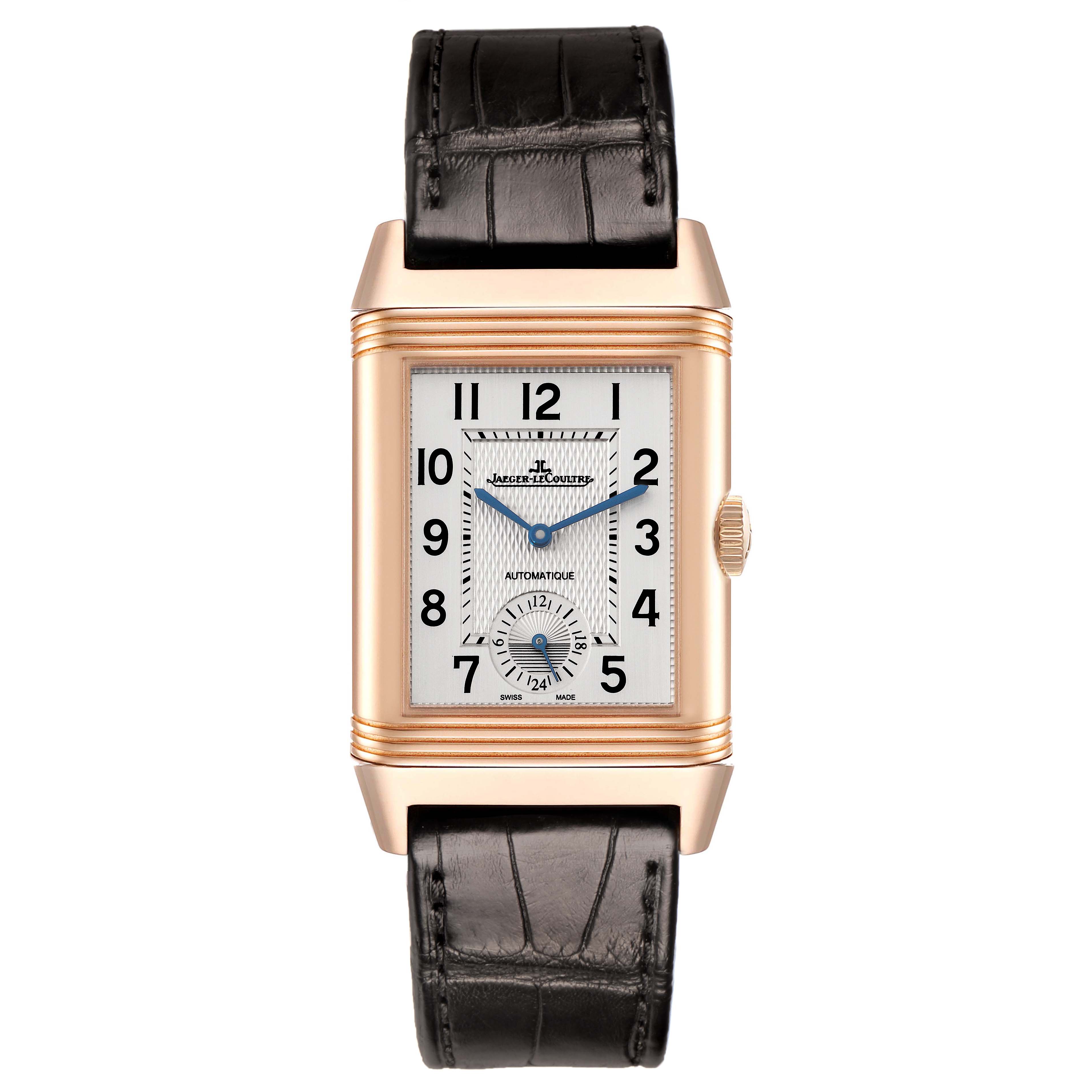 The image shows a frontal view of the Jaeger-LeCoultre Reverso watch, displaying its rectangular case, dial, crown, and black strap.