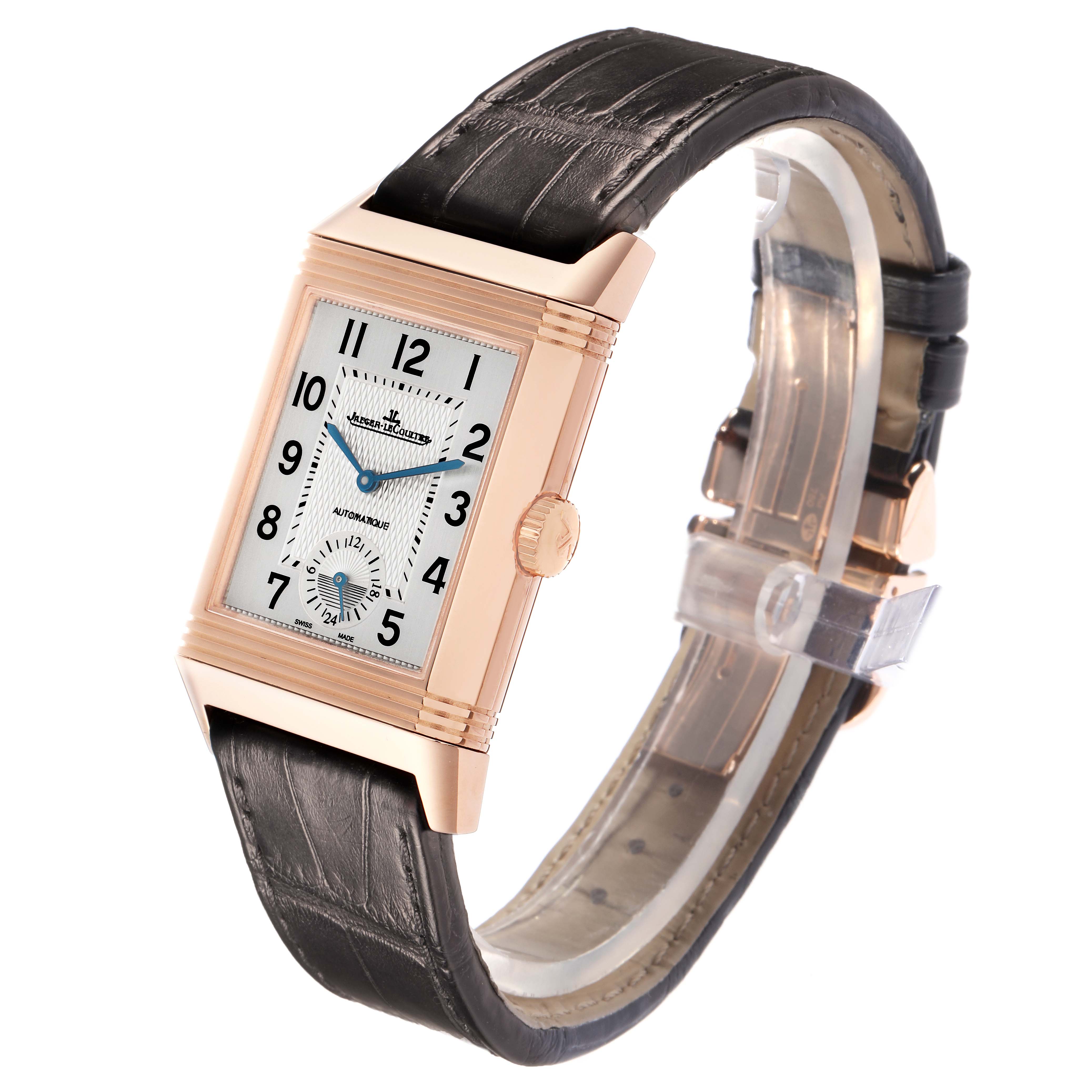 The Jaeger-LeCoultre Reverso watch is shown at an angle highlighting the face, crown, and leather strap.
