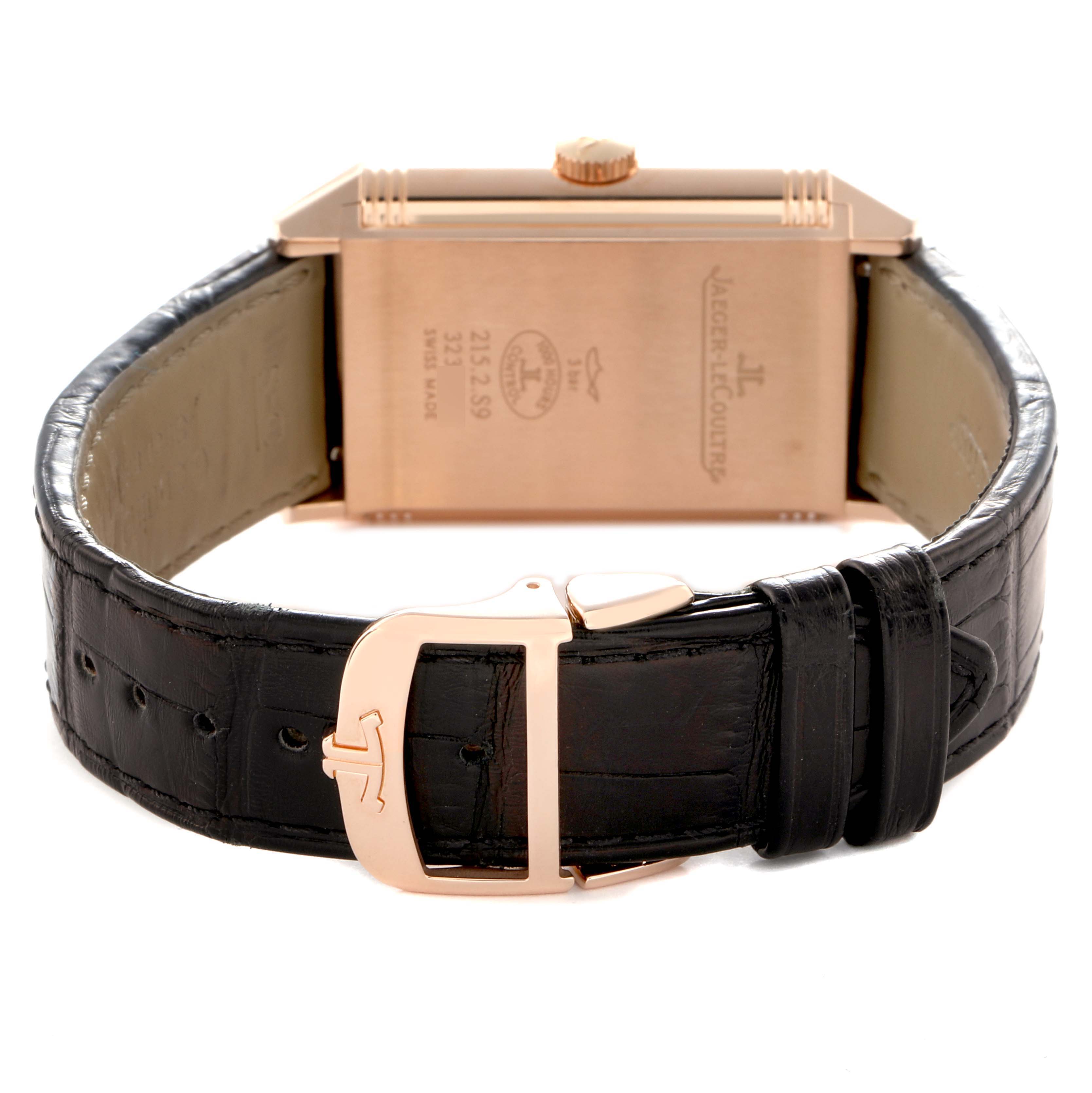 The image shows the back of a Jaeger LeCoultre Reverso Q3832420 Men's Rose Gold Silver Dial Q3832420 Men's Rose Gold Silver Dial watch, highlighting its rectangular case and black leather strap with a deployment buckle.
