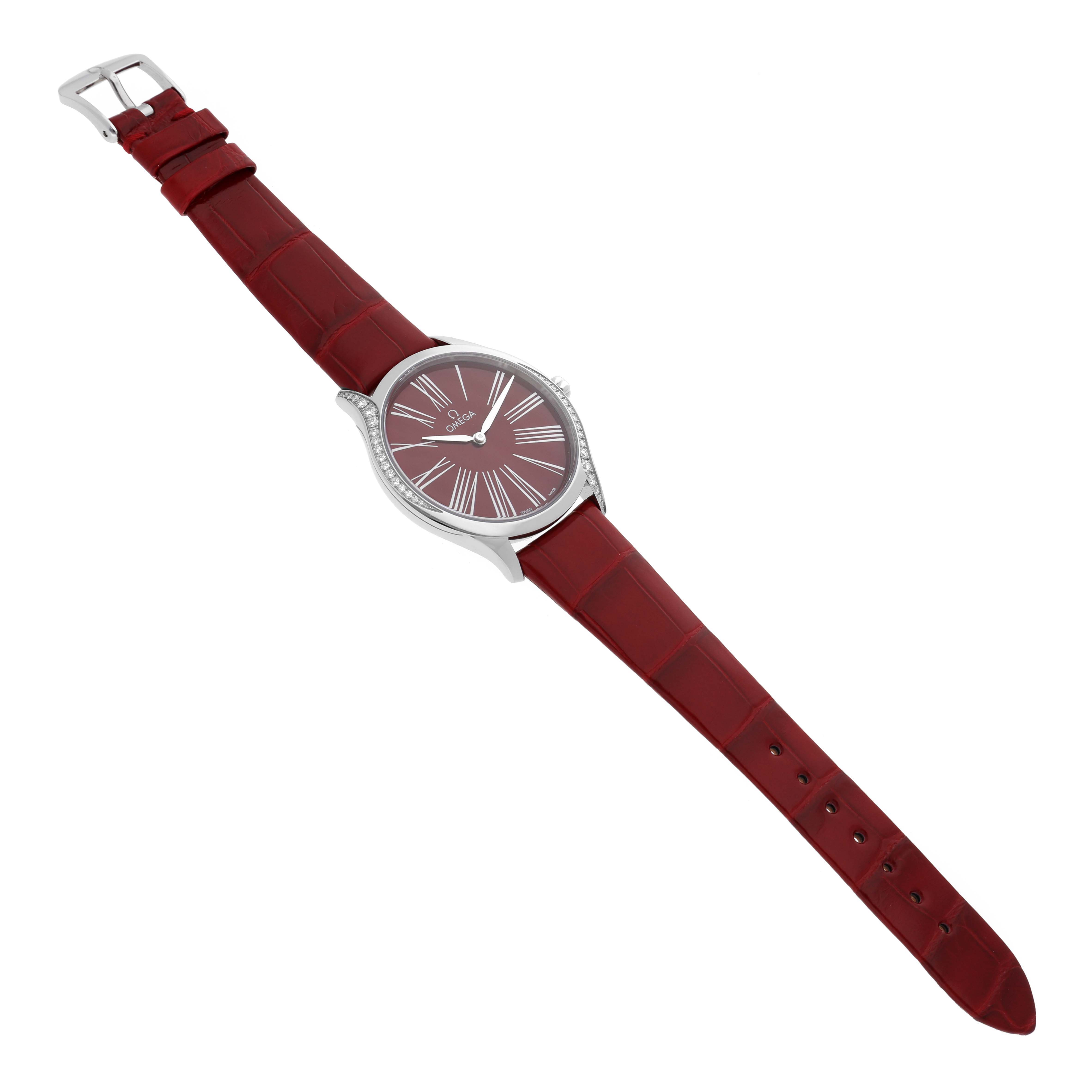 This image shows a top view of the Omega 428.18.36.60.11.002 Women's Stainless Steel Red Dial 428.18.36.60.11.002 Women's Stainless Steel Red Dial DeVille Tresor Diamond Red Dial Ladies Watch 428.18.36.60.11.002 with its red strap fully extended.