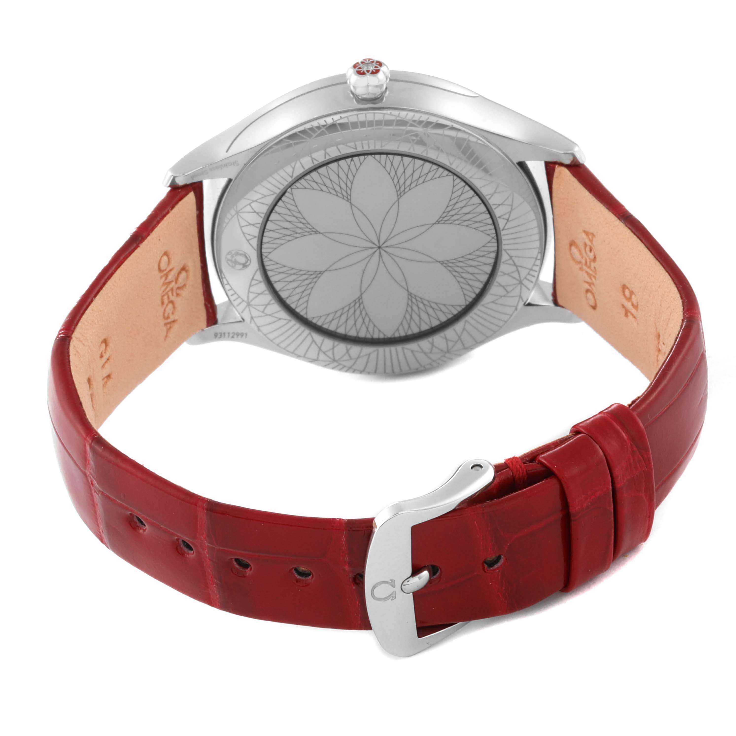 The image depicts the back and side of an Omega 428.18.36.60.11.002 Women's Stainless Steel Red Dial 428.18.36.60.11.002 Women's Stainless Steel Red Dial DeVille Tresor Diamond Red Dial Ladies Watch 428.18.36.60.11.002 with a red leather strap and buckle.