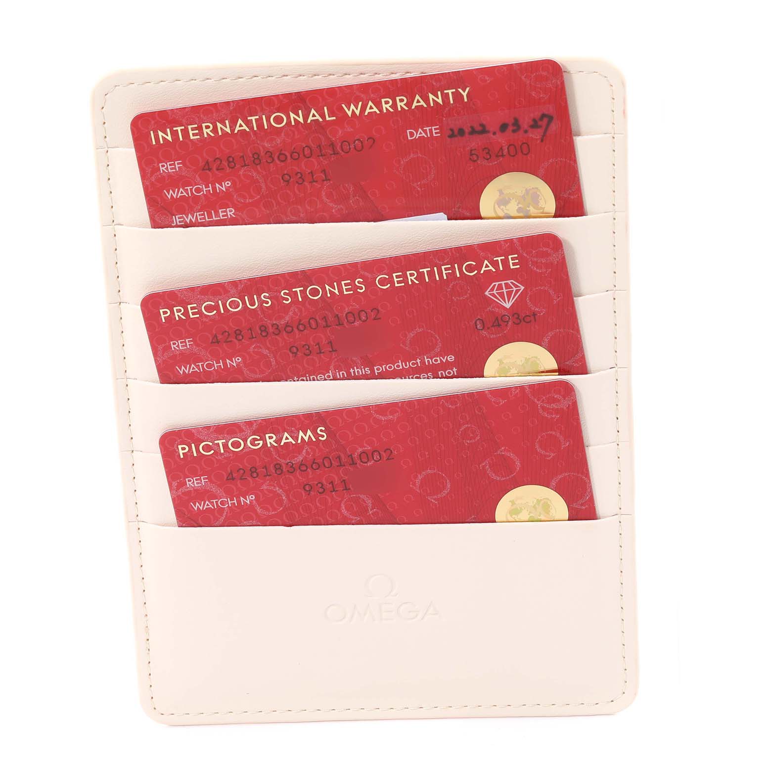 This image shows warranty and certification cards for the Omega 428.18.36.60.11.002 Women's Stainless Steel Red Dial 428.18.36.60.11.002 Women's Stainless Steel Red Dial DeVille Tresor Diamond Red Dial Ladies Watch, model 428.18.36.60.11.002.