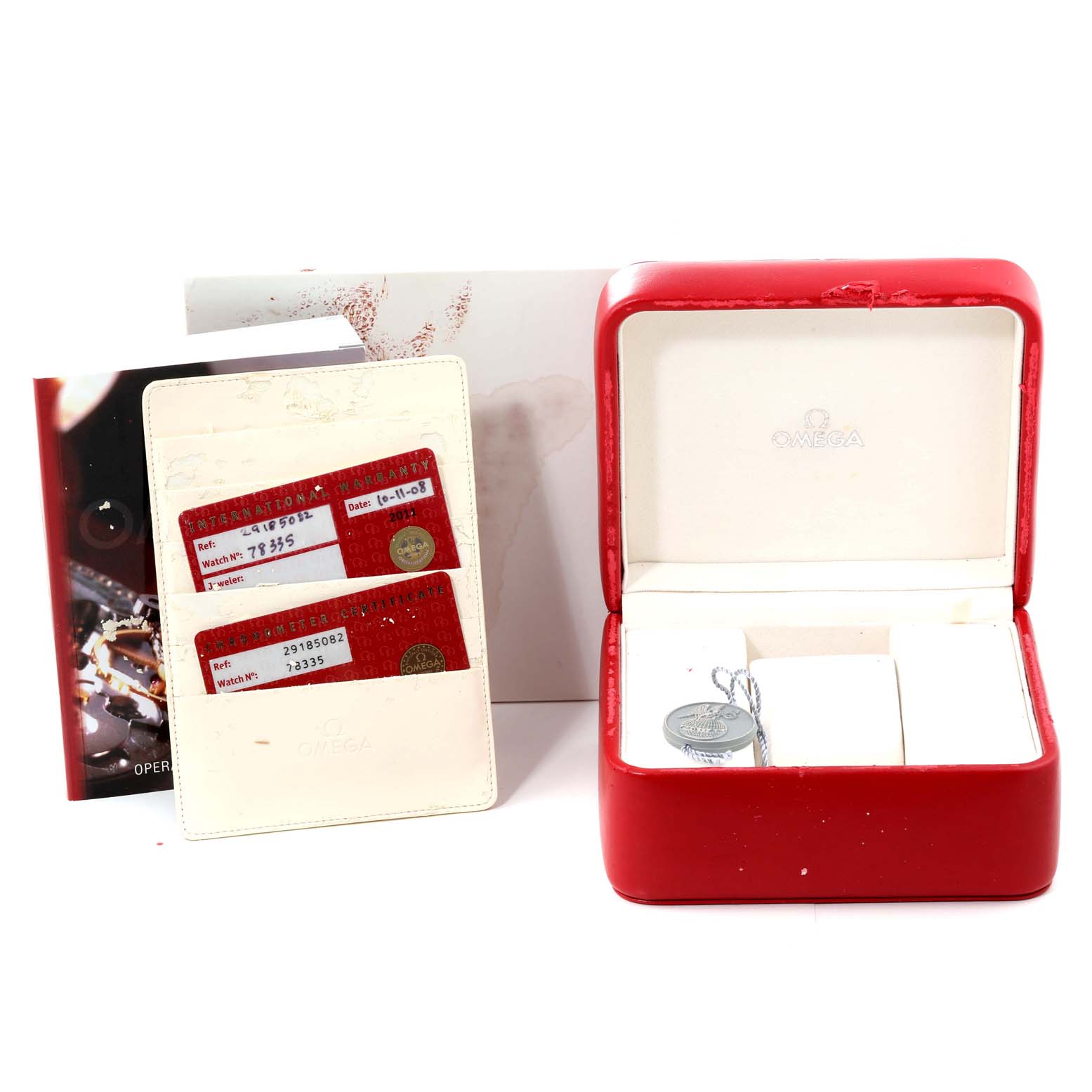 The image shows the accessories of the Omega Planet Ocean 2918.50.82 Men's Stainless Steel Black Dial 2918.50.82 Men's Stainless Steel Black Dial model, including the watch box, cards, and booklet.