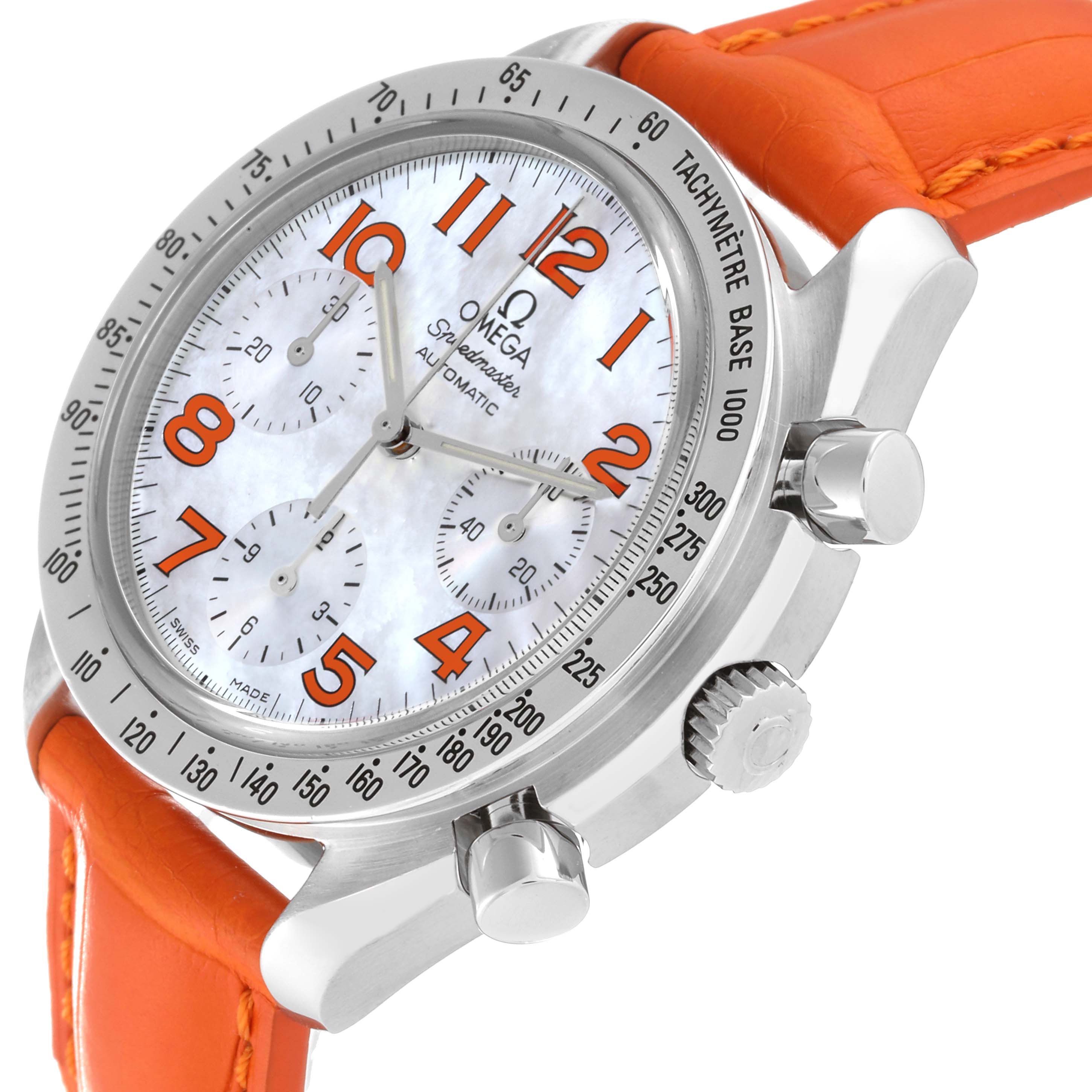 The Omega Speedmaster 3834.78.38 Men's Stainless Steel Mother of Pearl Dial 3834.78.38 Men's Stainless Steel Mother of Pearl Dial watch is shown at a slight angle, displaying the face, crown, pushers, and part of the orange band.