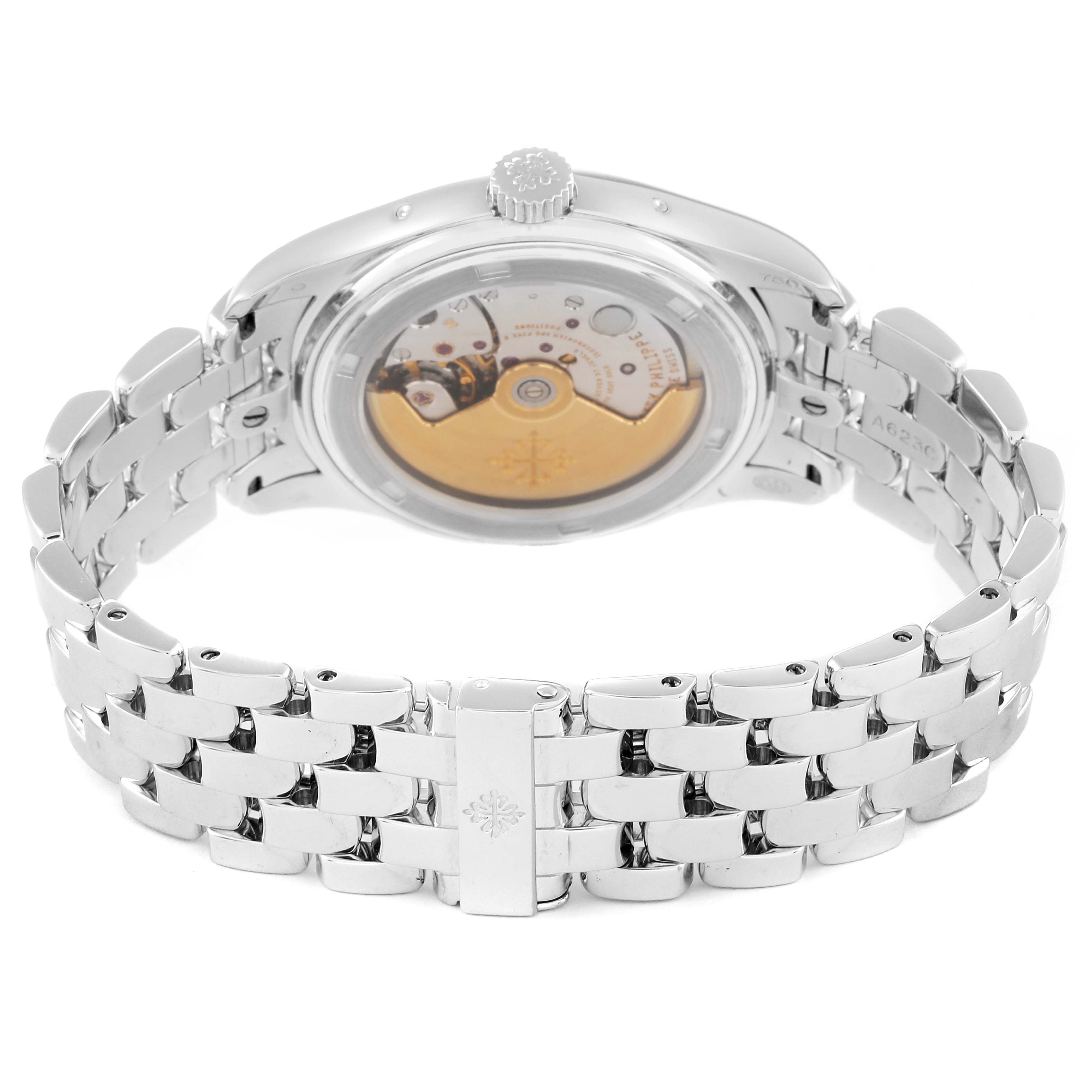 The image shows the back view of a Patek Philippe Complications 5036/1G Men's White Gold Black Dial 5036/1G Men's White Gold Black Dial model, highlighting the movement and metal bracelet.