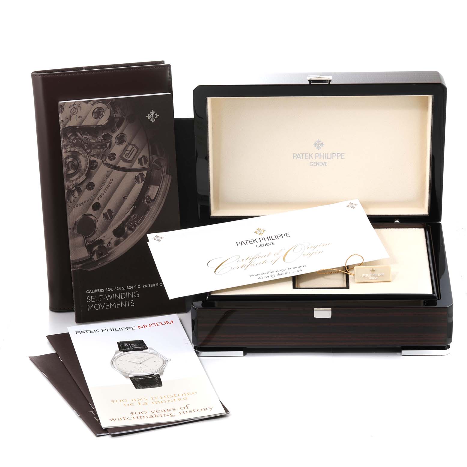 The angle shows the packaging of the Patek Philippe Aquanaut 5167A Men's Stainless Steel Black Dial 5167A Men's Stainless Steel Black Dial, including the box, booklets, and certification papers.