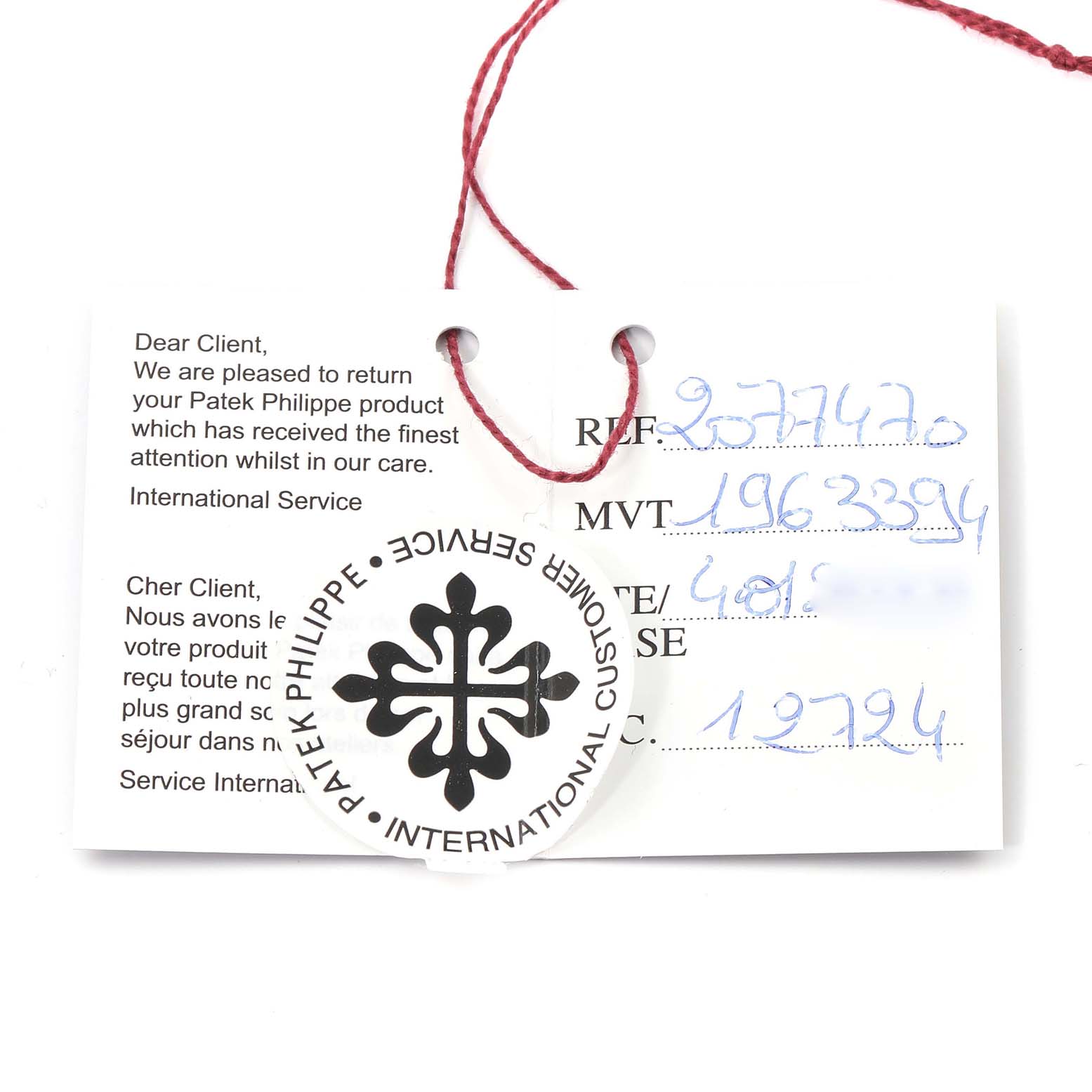 The image shows a Patek Philippe service tag with a red string attached, along with a service document for a Calatrava model.