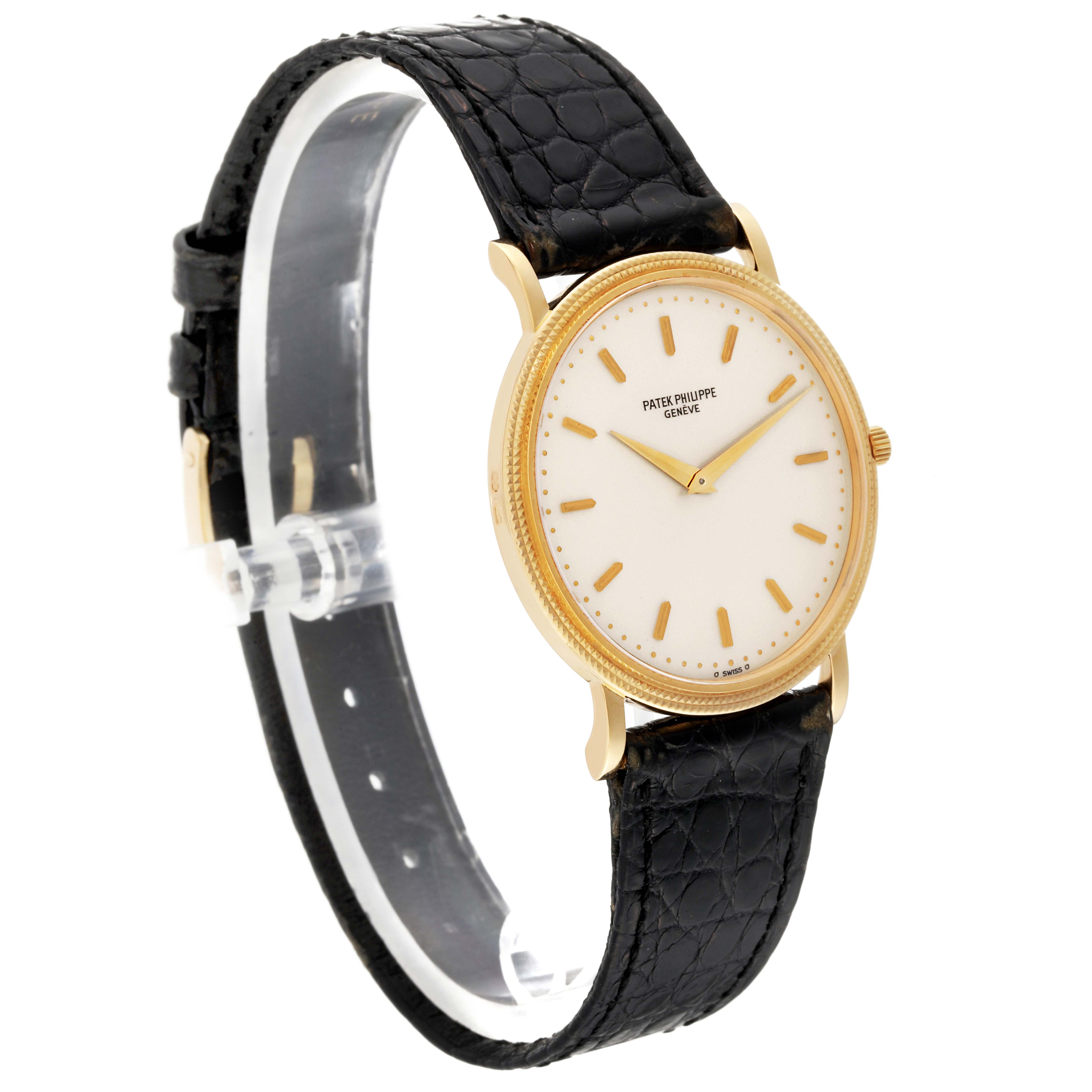 This image shows a Patek Philippe Calatrava 3520D Men's Yellow Gold Beige Dial 3520D Men's Yellow Gold Beige Dial watch angled slightly to the right, displaying the face and black leather strap.