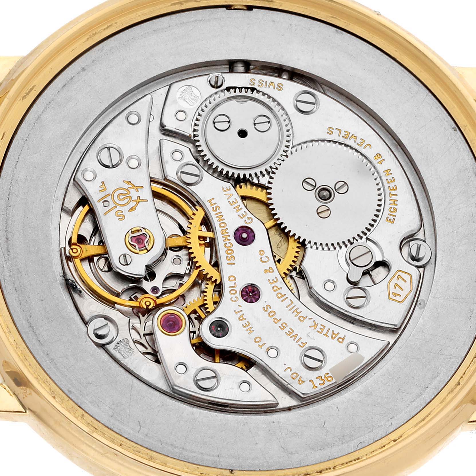 This image shows the back of a Patek Philippe Calatrava 3520D Men's Yellow Gold Beige Dial 3520D Men's Yellow Gold Beige Dial watch, highlighting its intricate movement and gears.