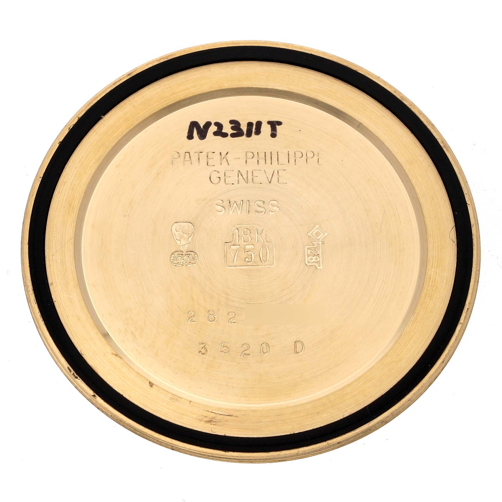 The image shows the back cover of a Patek Philippe Calatrava 3520D Men's Yellow Gold Beige Dial 3520D Men's Yellow Gold Beige Dial watch, highlighting inscriptions and gold markings.