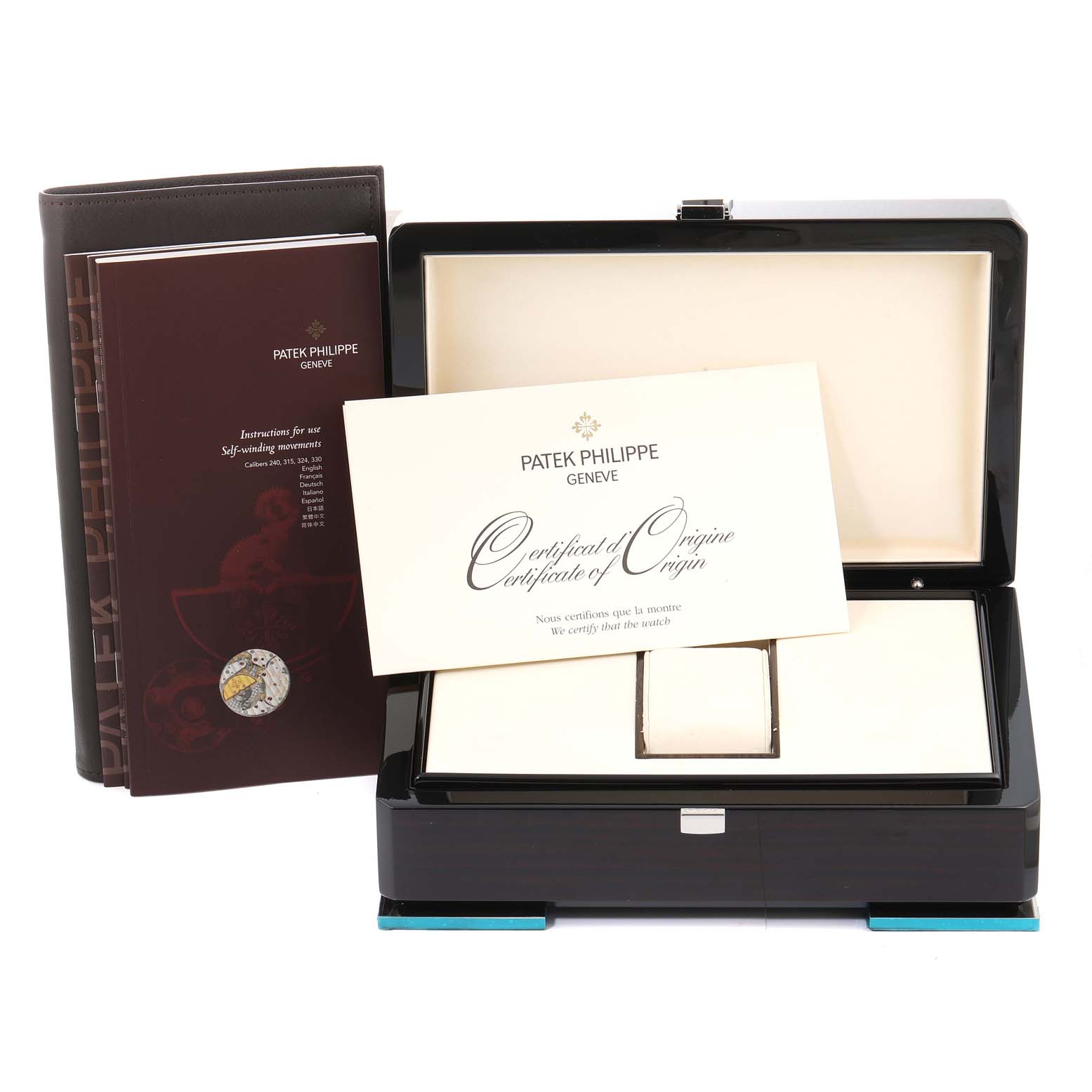 This image shows the packaging, certificate, and manual of the Patek Philippe Calatrava 5120/1G-001 Men's White Gold Silver Dial 5120/1G-001 Men's White Gold Silver Dial watch, taken from the front angle.