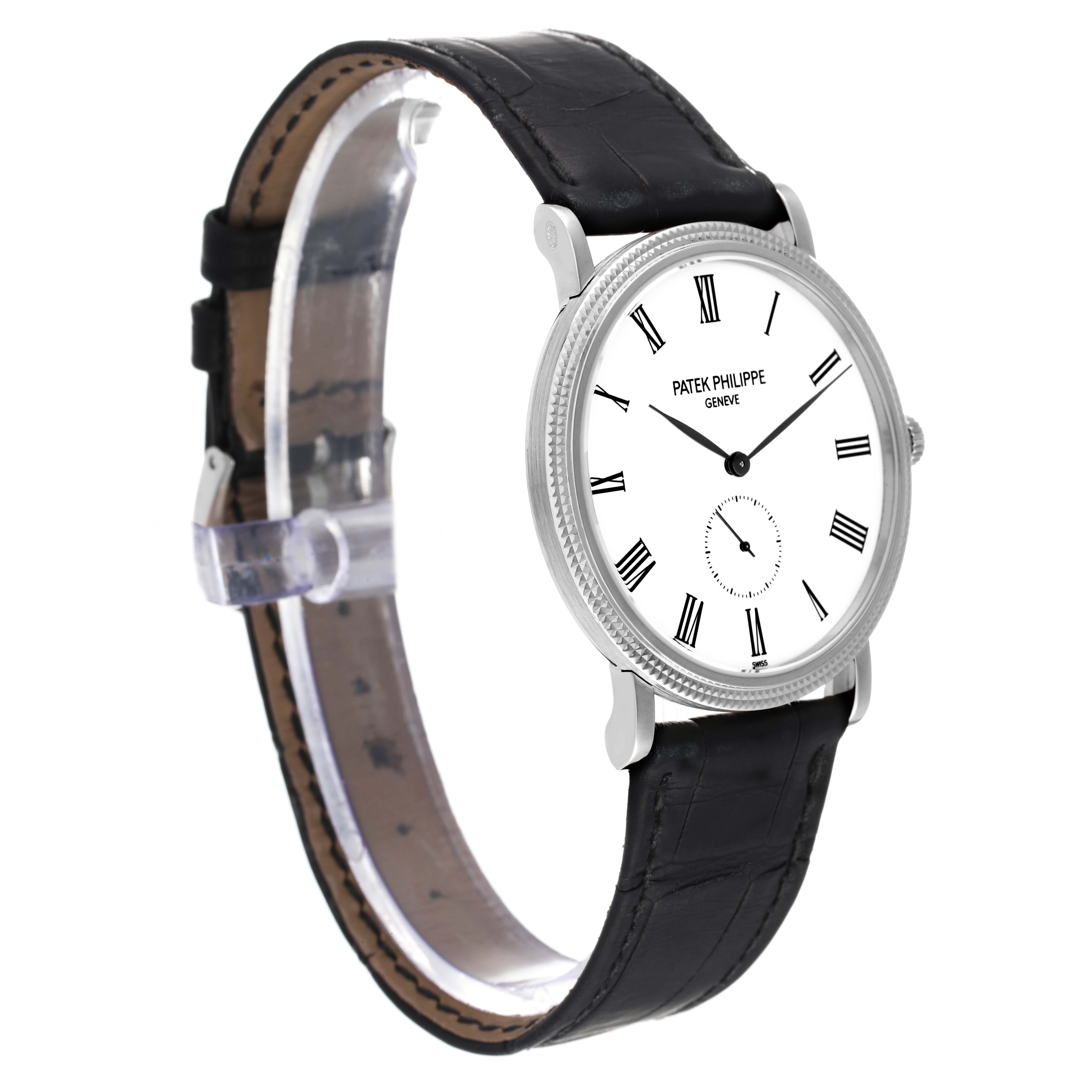 The image shows a side angle of the Patek Philippe Calatrava 5119G Men
s White Gold White Dial 5119G Men
s White Gold White Dial watch, featuring its black leather strap and white dial with Roman numerals.