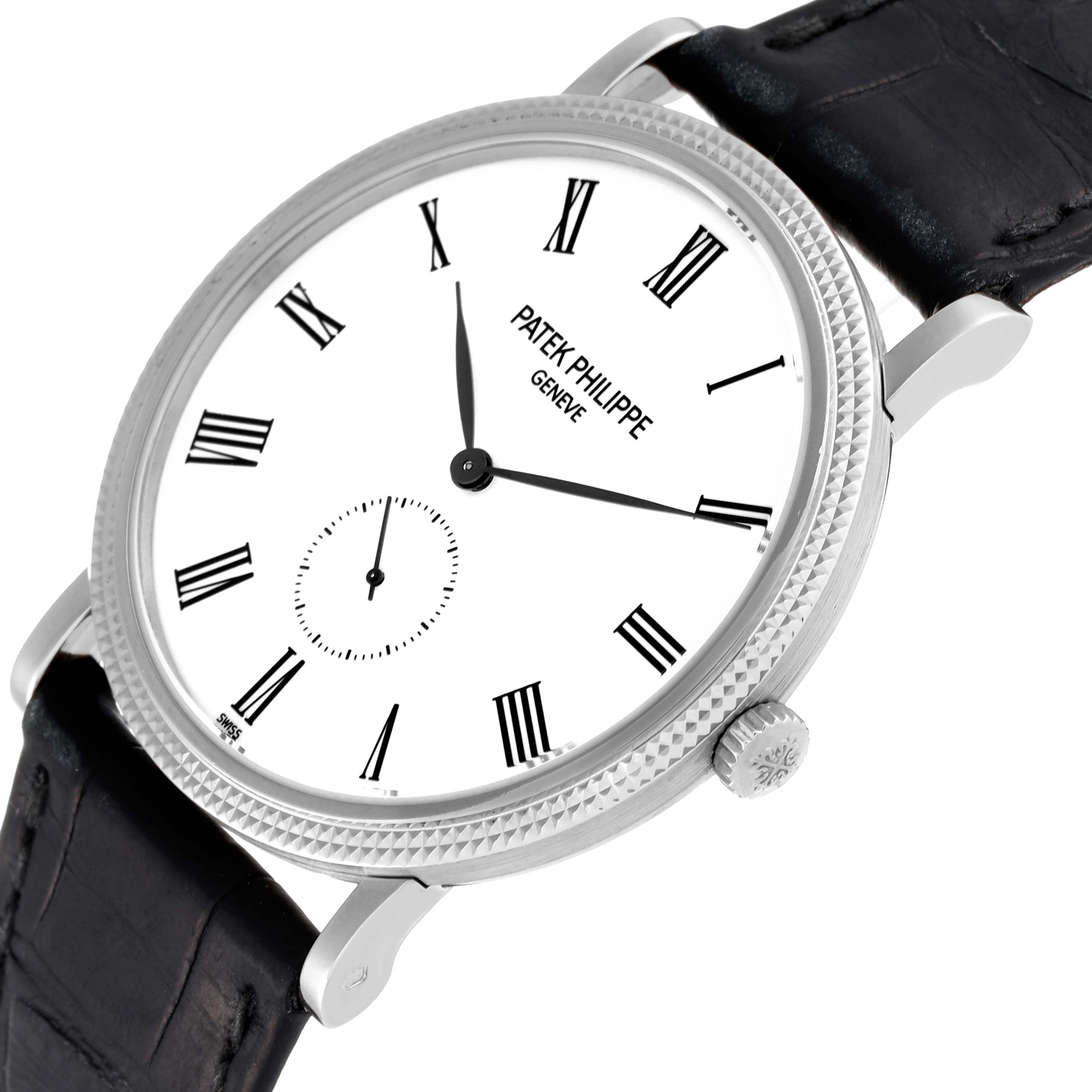 The image shows a Patek Philippe Calatrava 5119G Men
s White Gold White Dial 5119G Men
s White Gold White Dial watch at an angled close-up, highlighting the face, bezel, crown, and part of the strap.