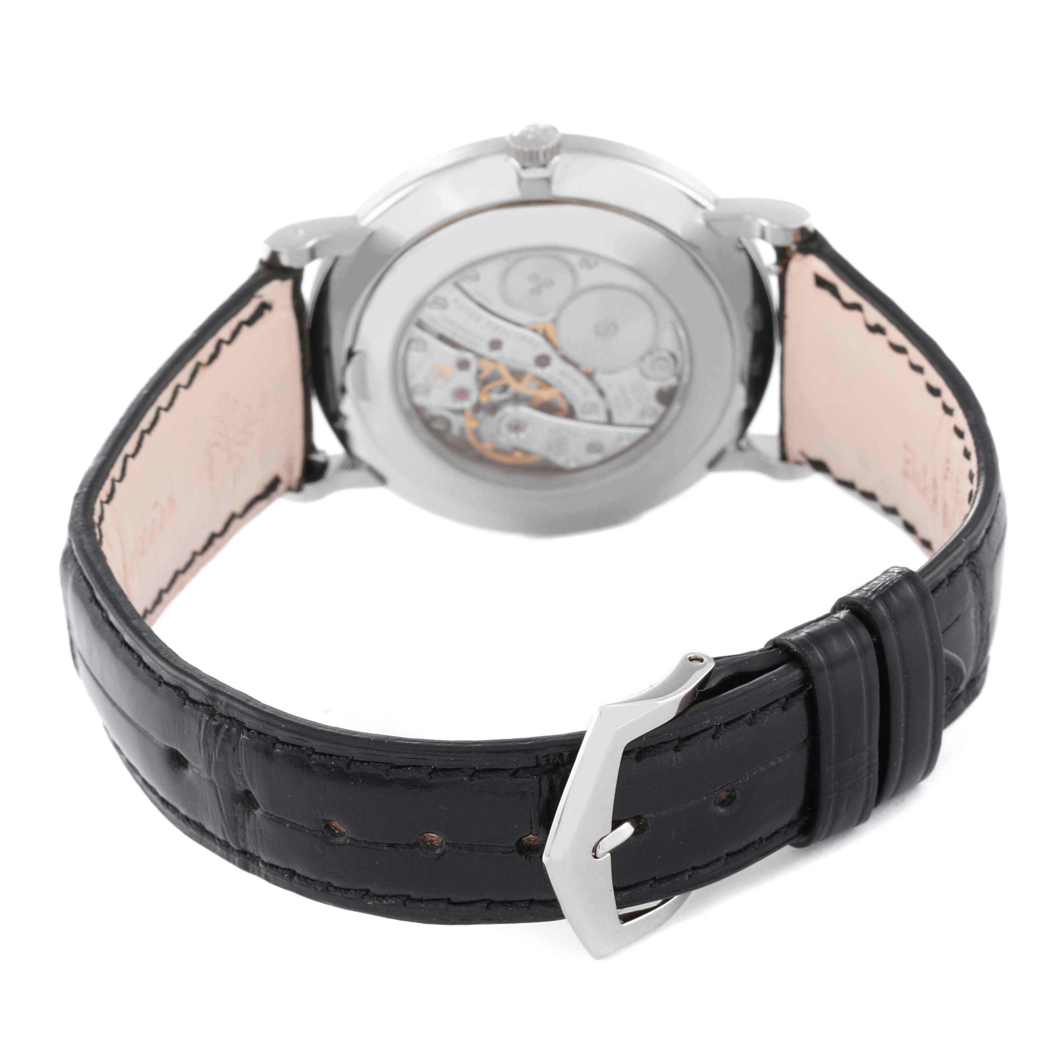 The image shows the back view of the Patek Philippe Calatrava 5116G Men's White Gold White Dial 5116G Men's White Gold White Dial watch, highlighting the movement and black leather strap.