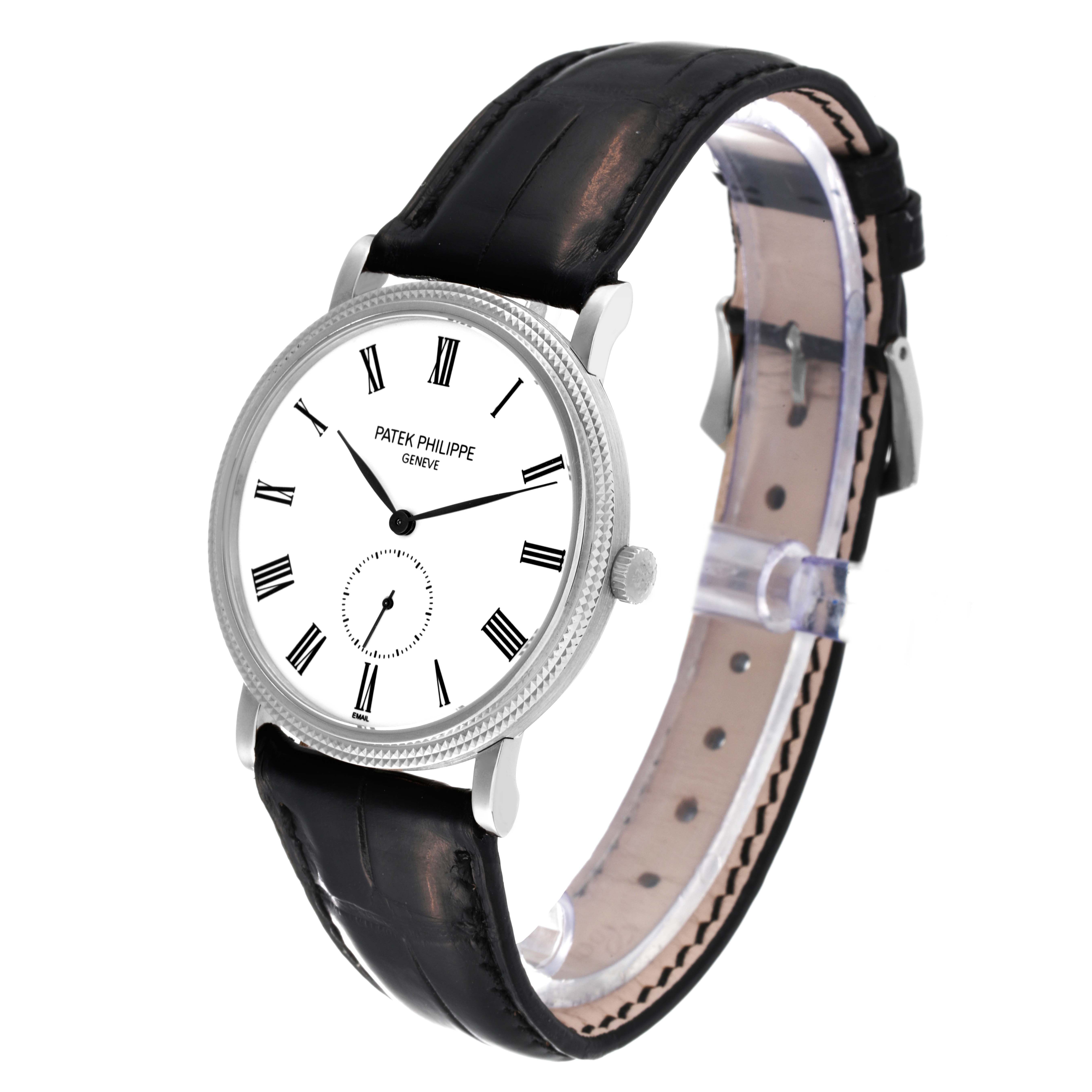 The image shows a Patek Philippe Calatrava 5116G Men's White Gold White Dial 5116G Men's White Gold White Dial watch, viewed at an angle showcasing the face, crown, and black leather strap.
