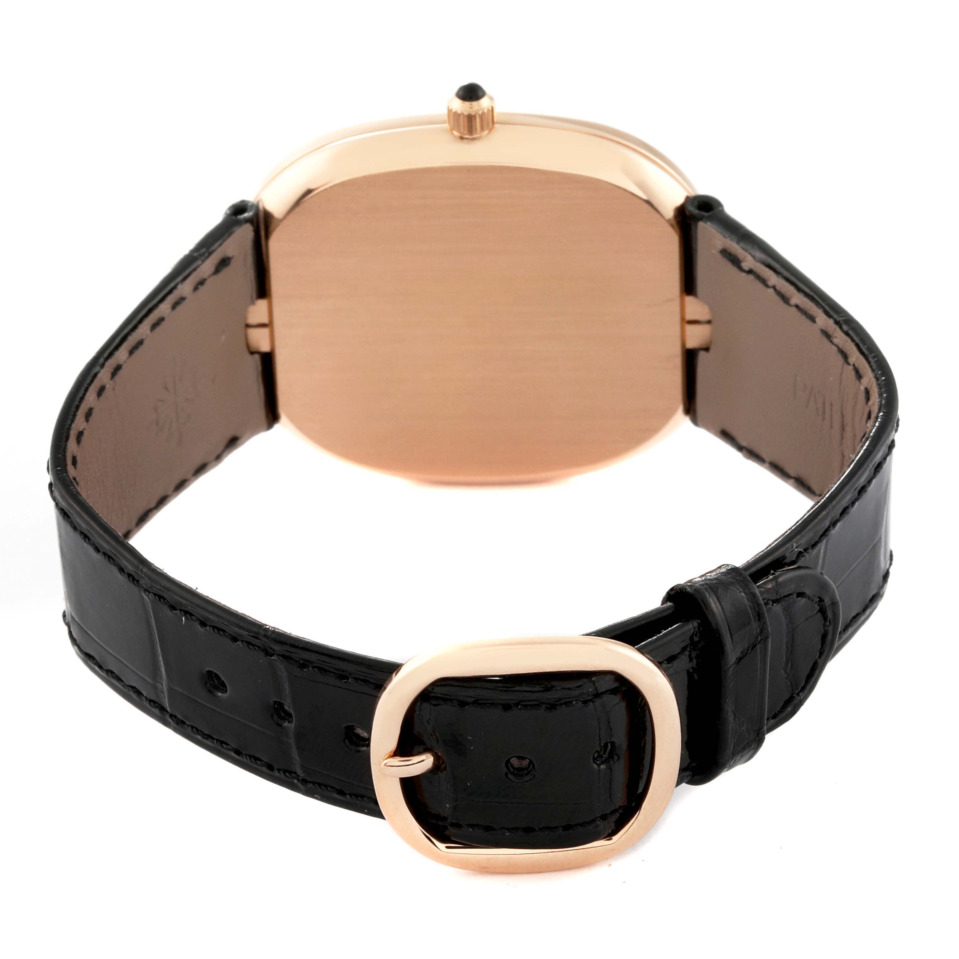 The image shows the back view of the Patek Philippe Golden Ellipse 5738R-001 Men's Rose Gold Black Dial 5738R-001 Men's Rose Gold Black Dial watch, featuring its strap and buckle.