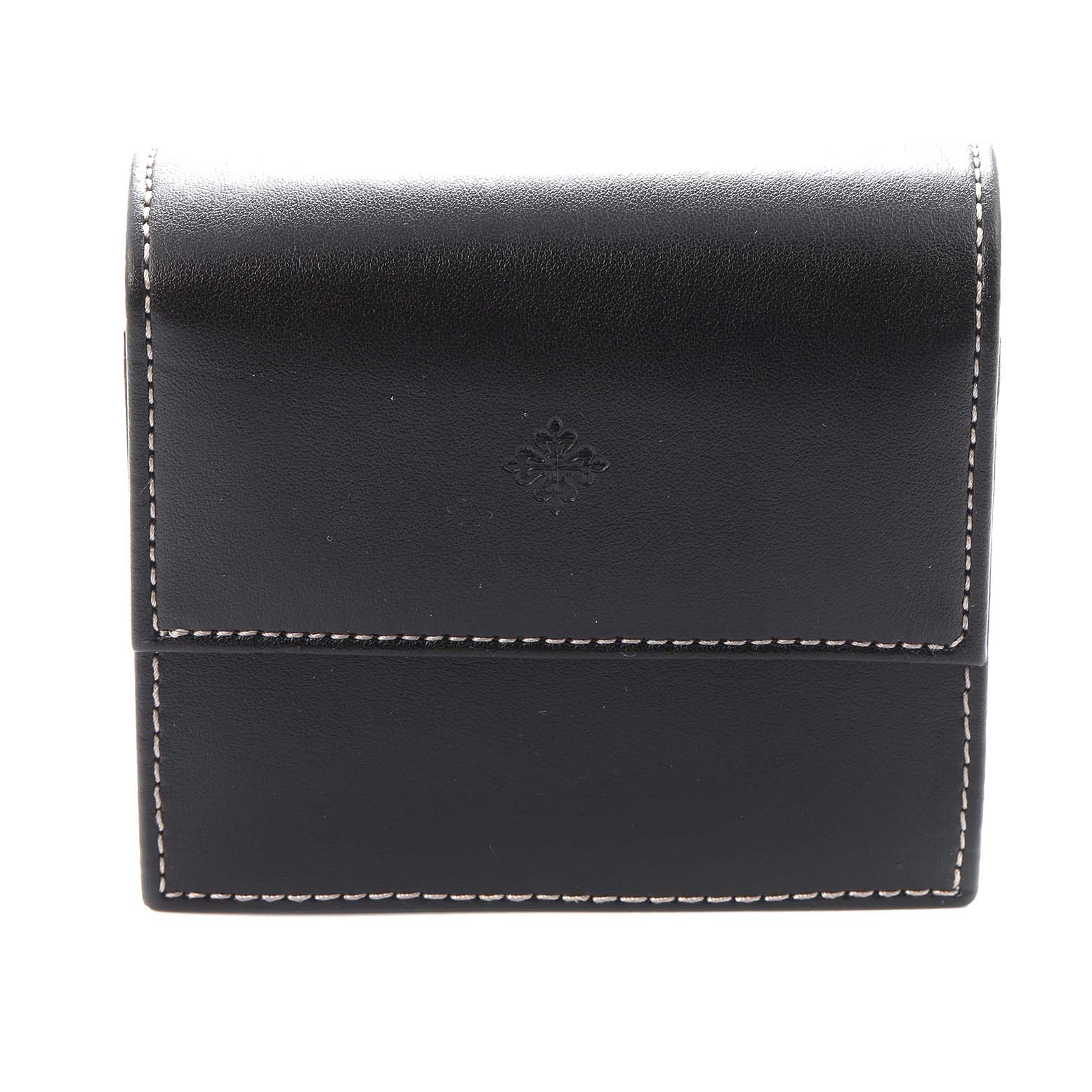 The image shows a black leather case for a Patek Philippe Gondolo 5124J-001 Men
s Yellow Gold Silver Dial 5124J-001 Men
s Yellow Gold Silver Dial watch, with white stitching and an embossed logo.