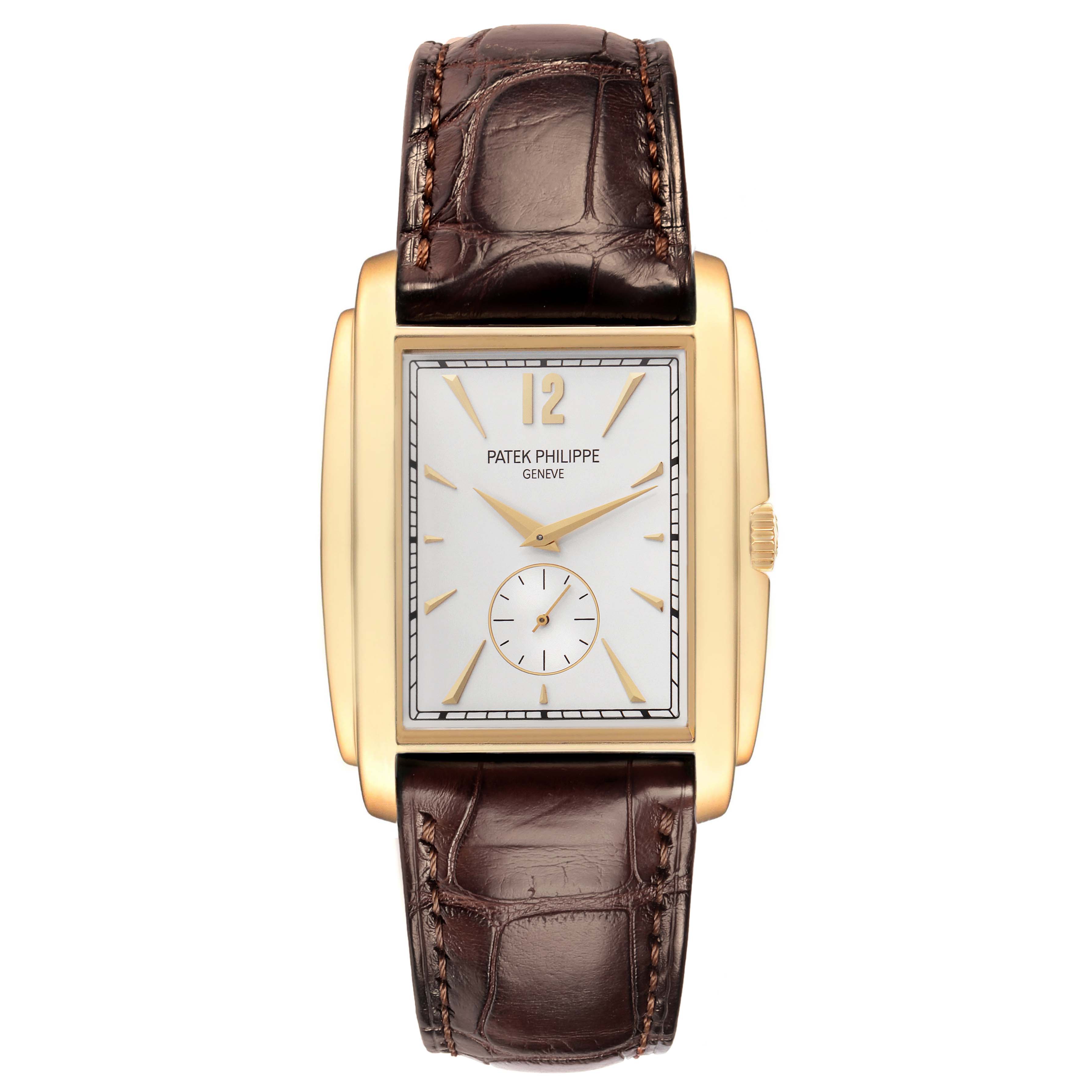 The image displays a Patek Philippe Gondolo 5124J-001 Men
s Yellow Gold Silver Dial 5124J-001 Men
s Yellow Gold Silver Dial watch from a top-down angle, showing the face, gold case, crown, and brown leather strap.